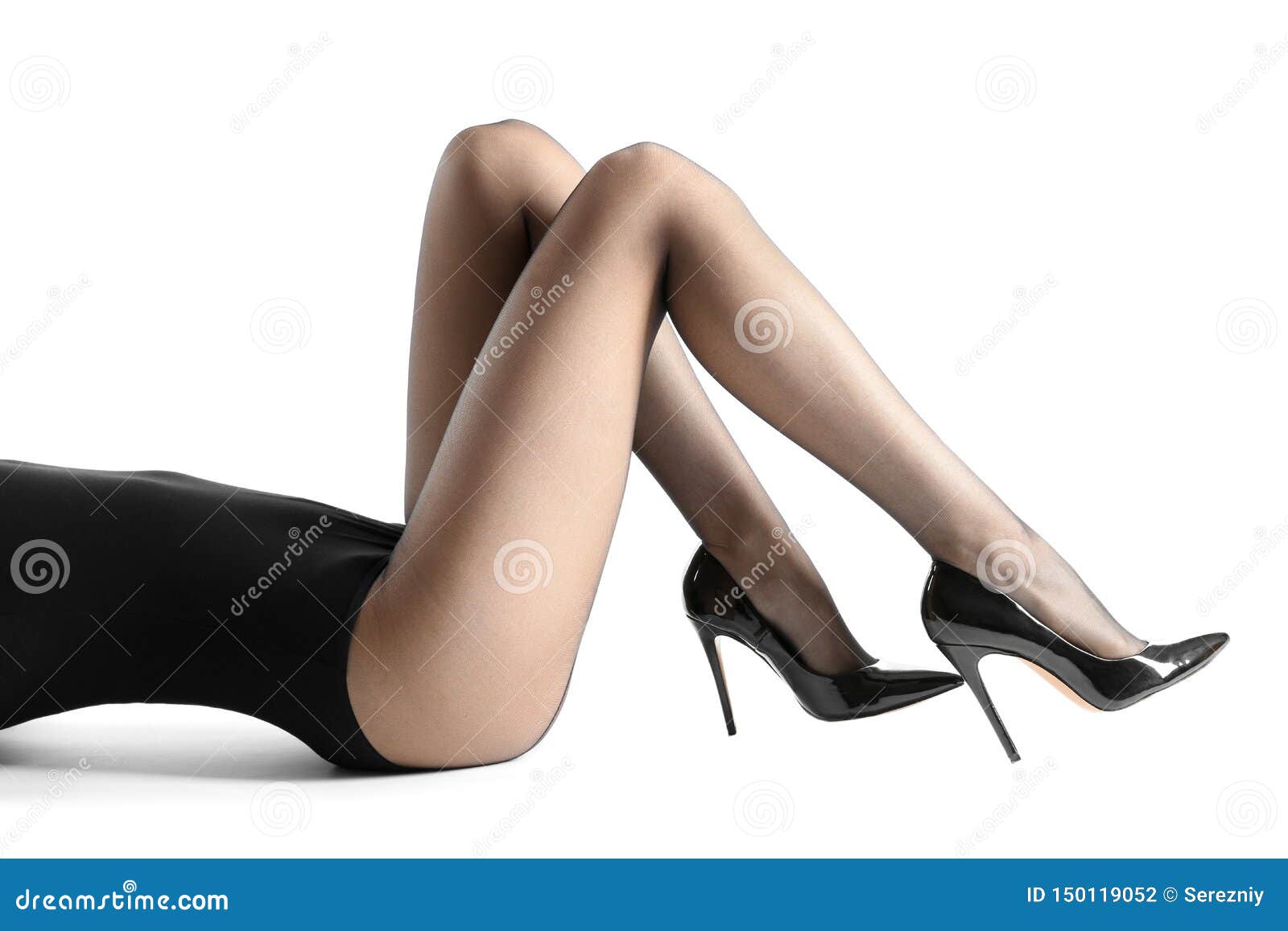 legs of beautiful young woman in tights on white background