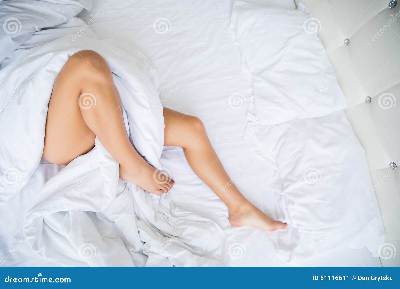 Legs on the Bed in White Bedclothes Stock Image Image of cultivation, fashion 81116611