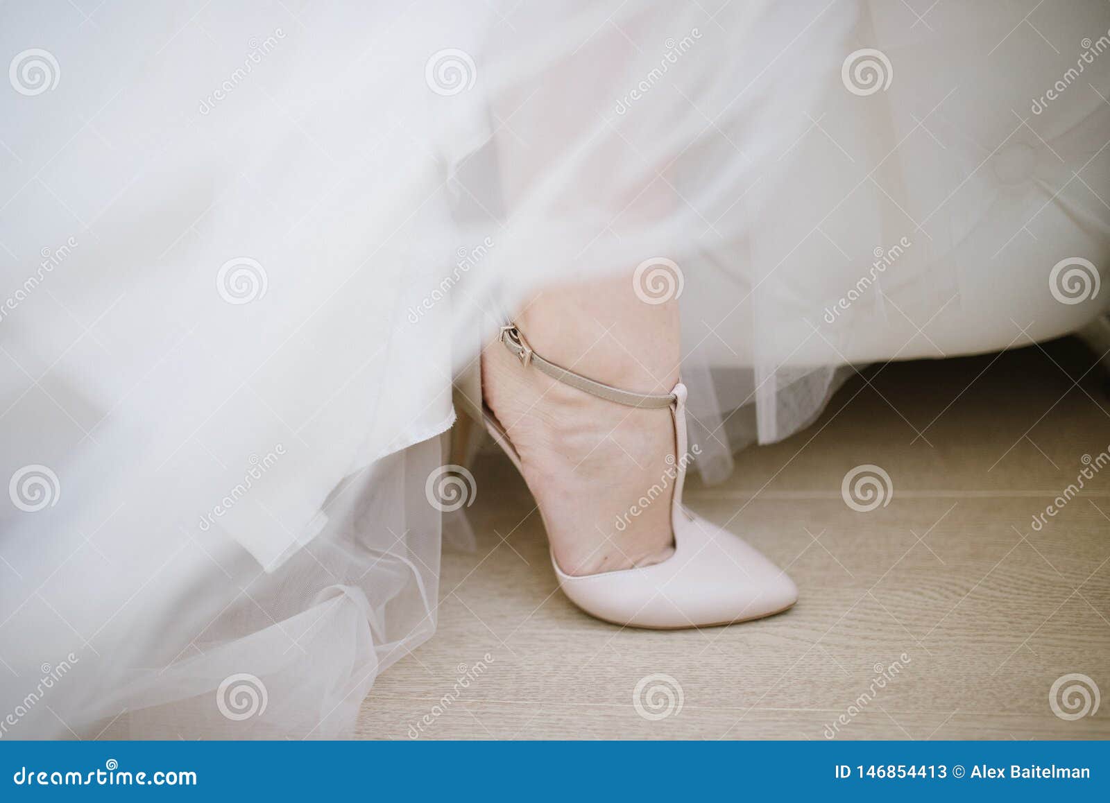 The Legs of the Bride in a Wedding Dress in Shoes Stock Image - Image ...