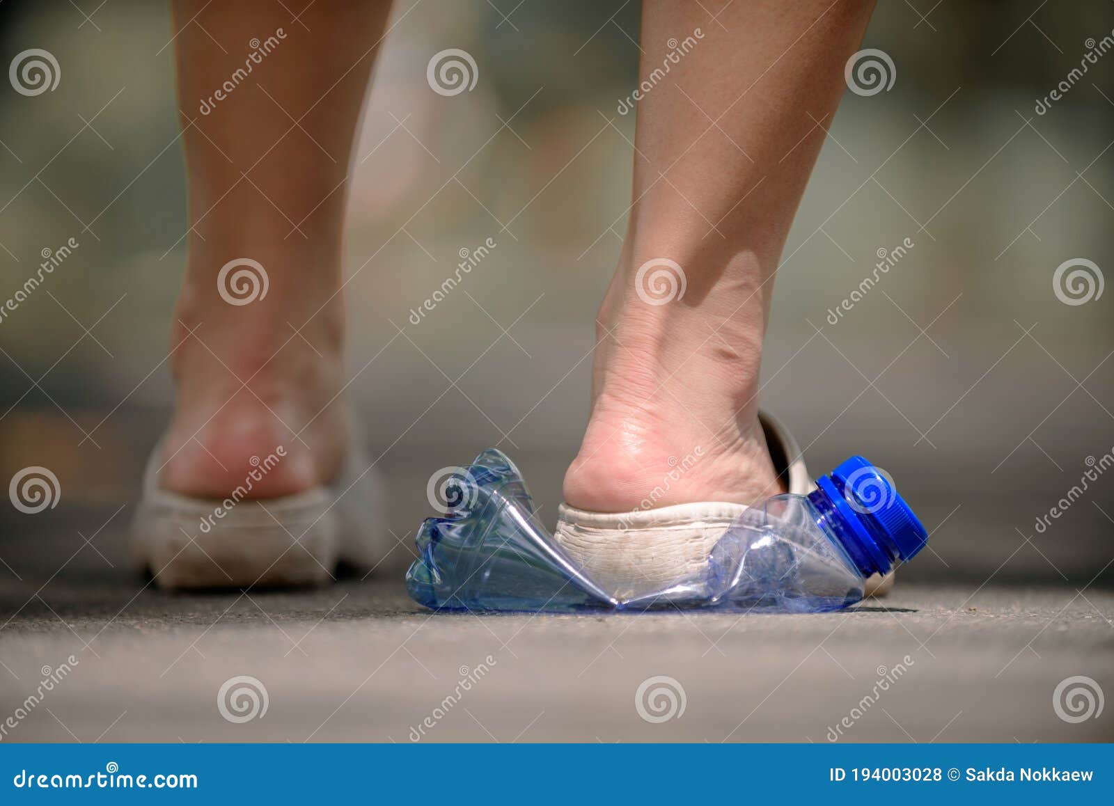 Legs crush plastic bottle stock photo. Image of consumption