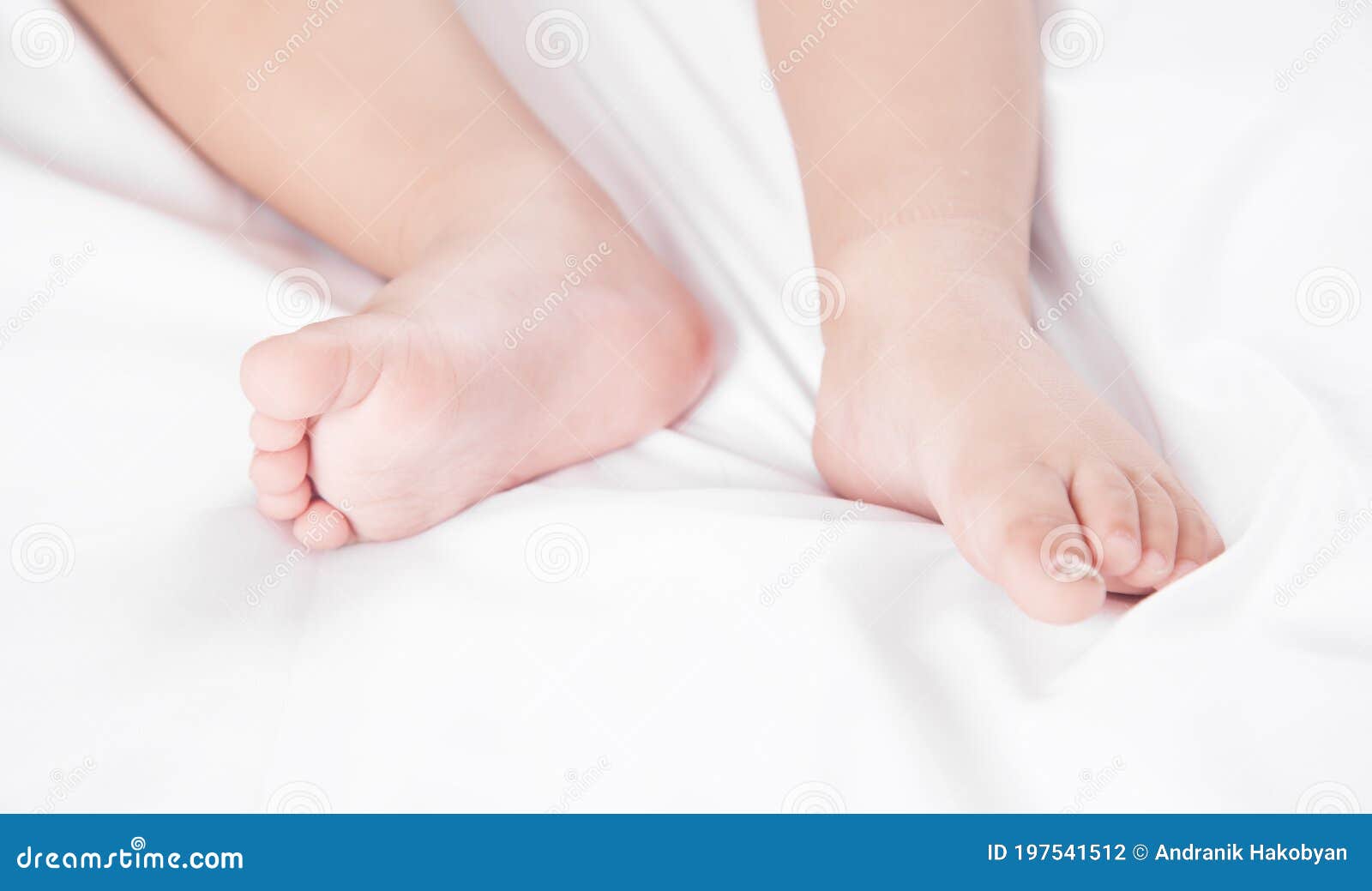 Legs of Little Baby Lying on Bed Stock Photo Image of closeup, small 197541512