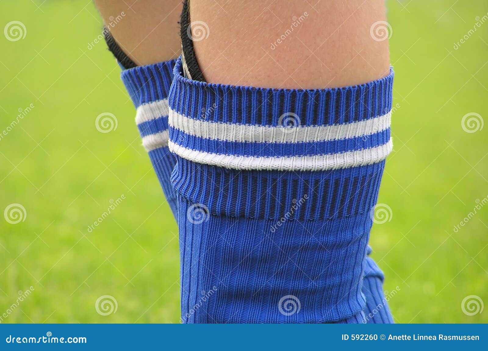 Legs of a soccer boy stock photo. Image of activity, green 592260