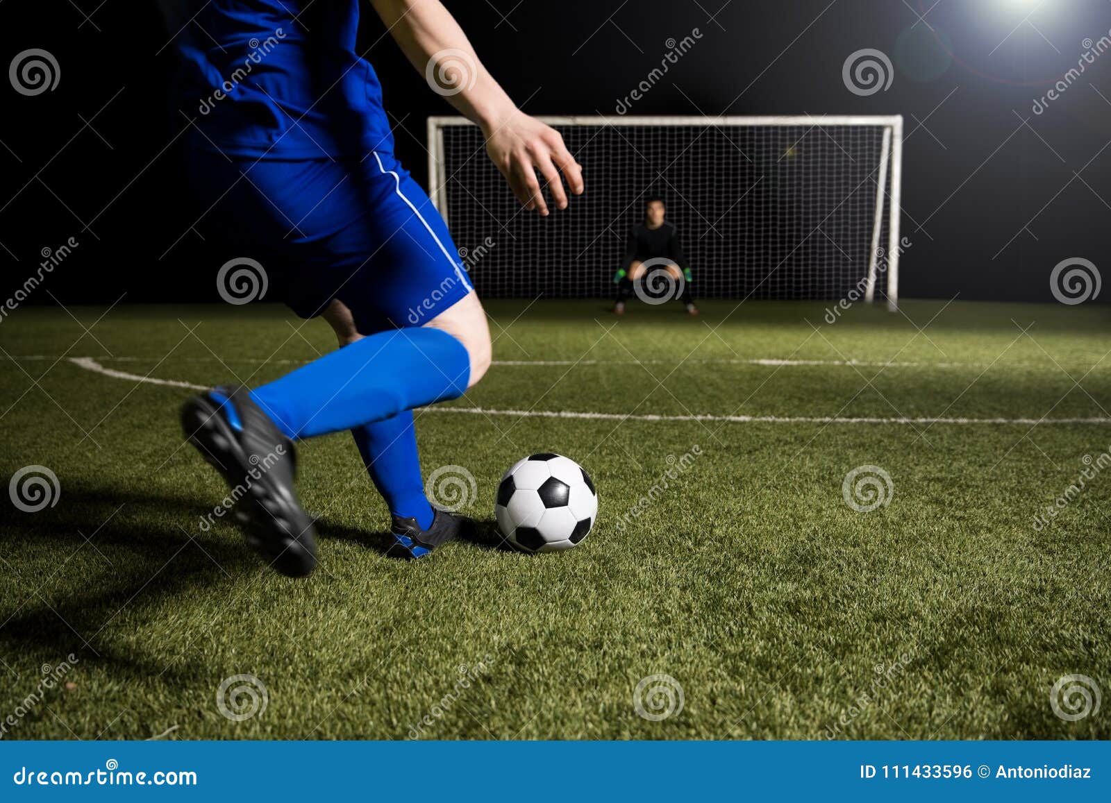 Soccer Player Making A Kick Towards The Goal Stock Photo Image