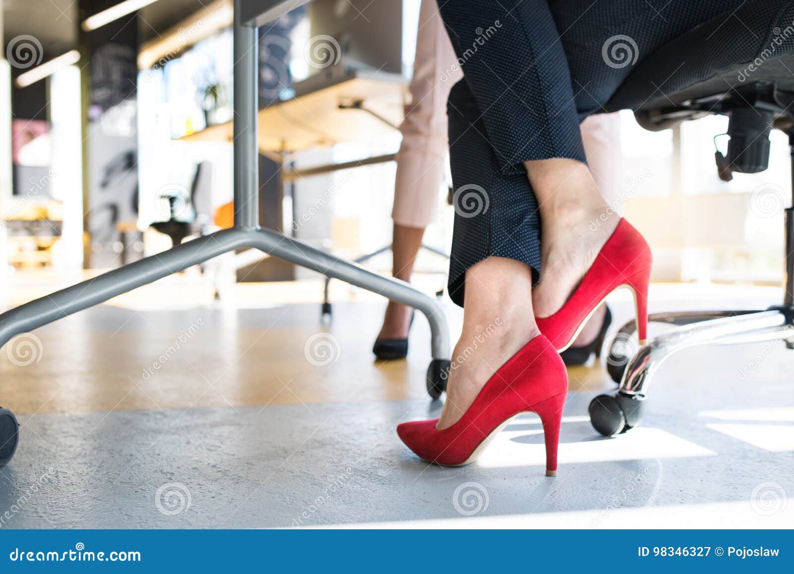 legs of unregognizable business women in high heels.