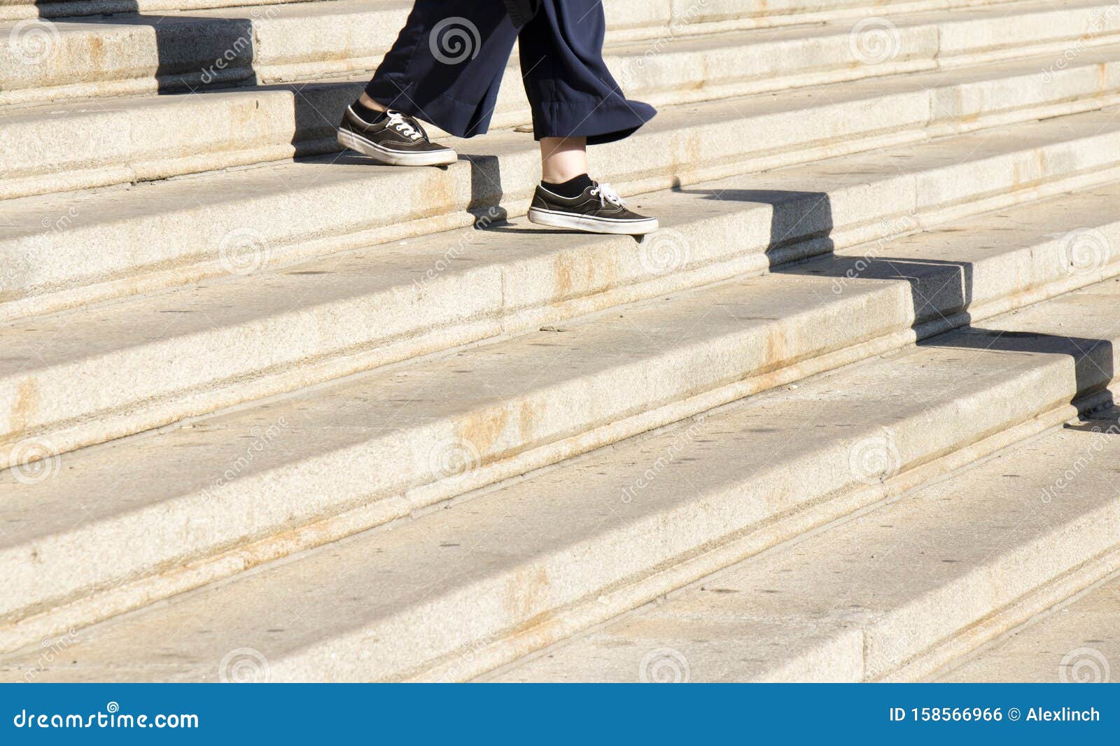 Legs of Young Woman Iin Sneaker Shoes Walking Down City Stairs Stock ...