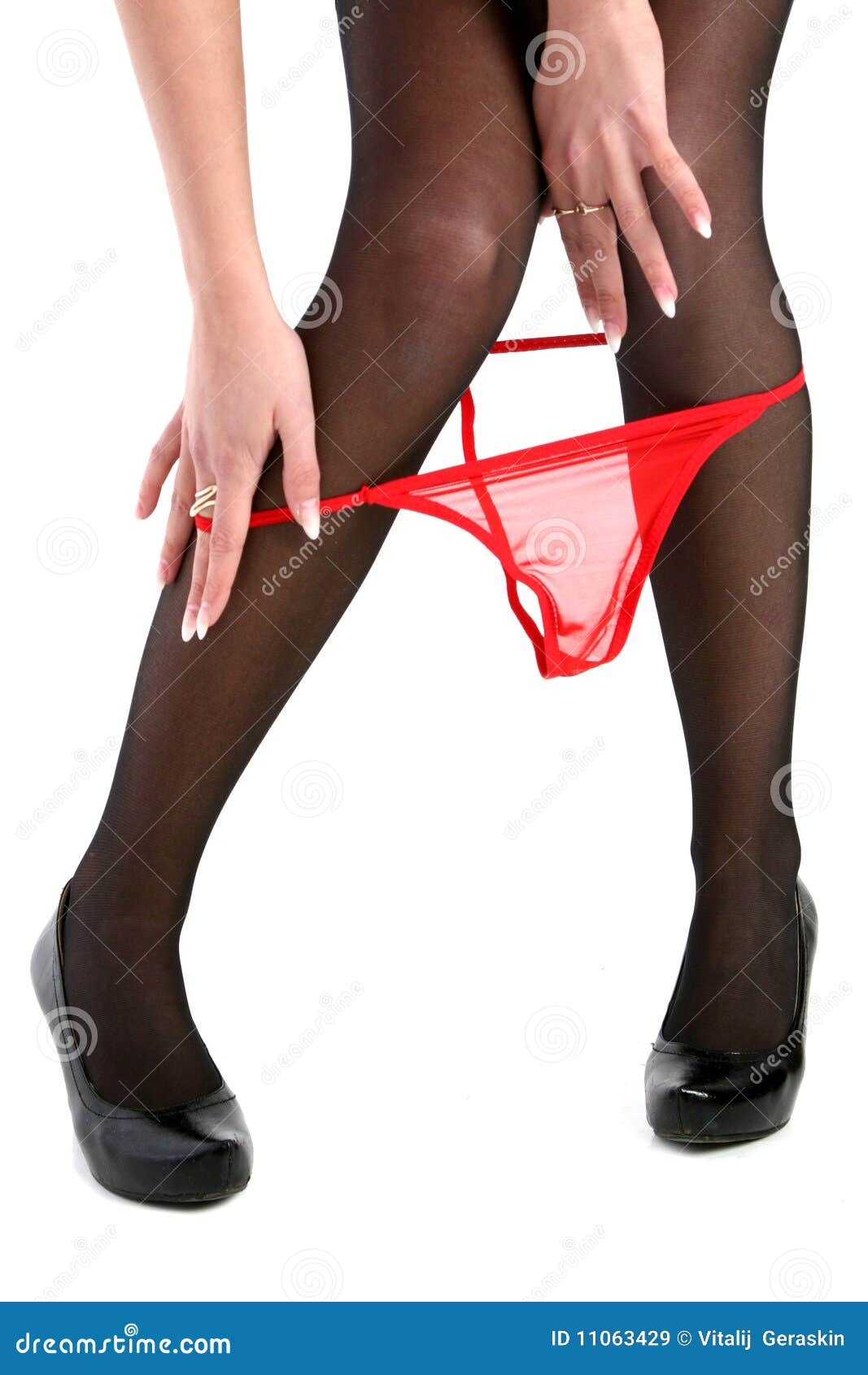 Legs of a Young Woman while Undress Panties. Stock Image - Image