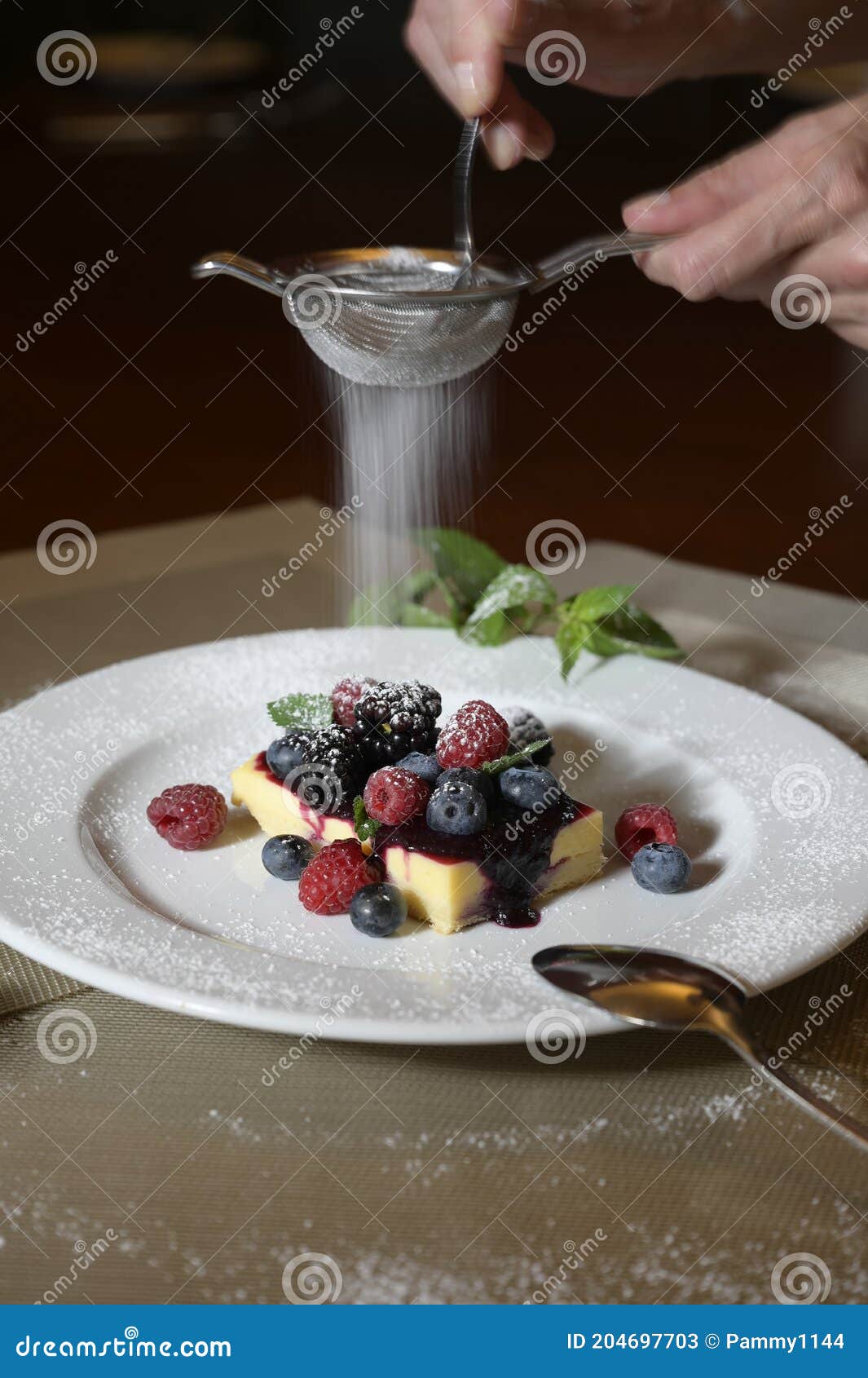 lemon cake with fruits and icing sugar.