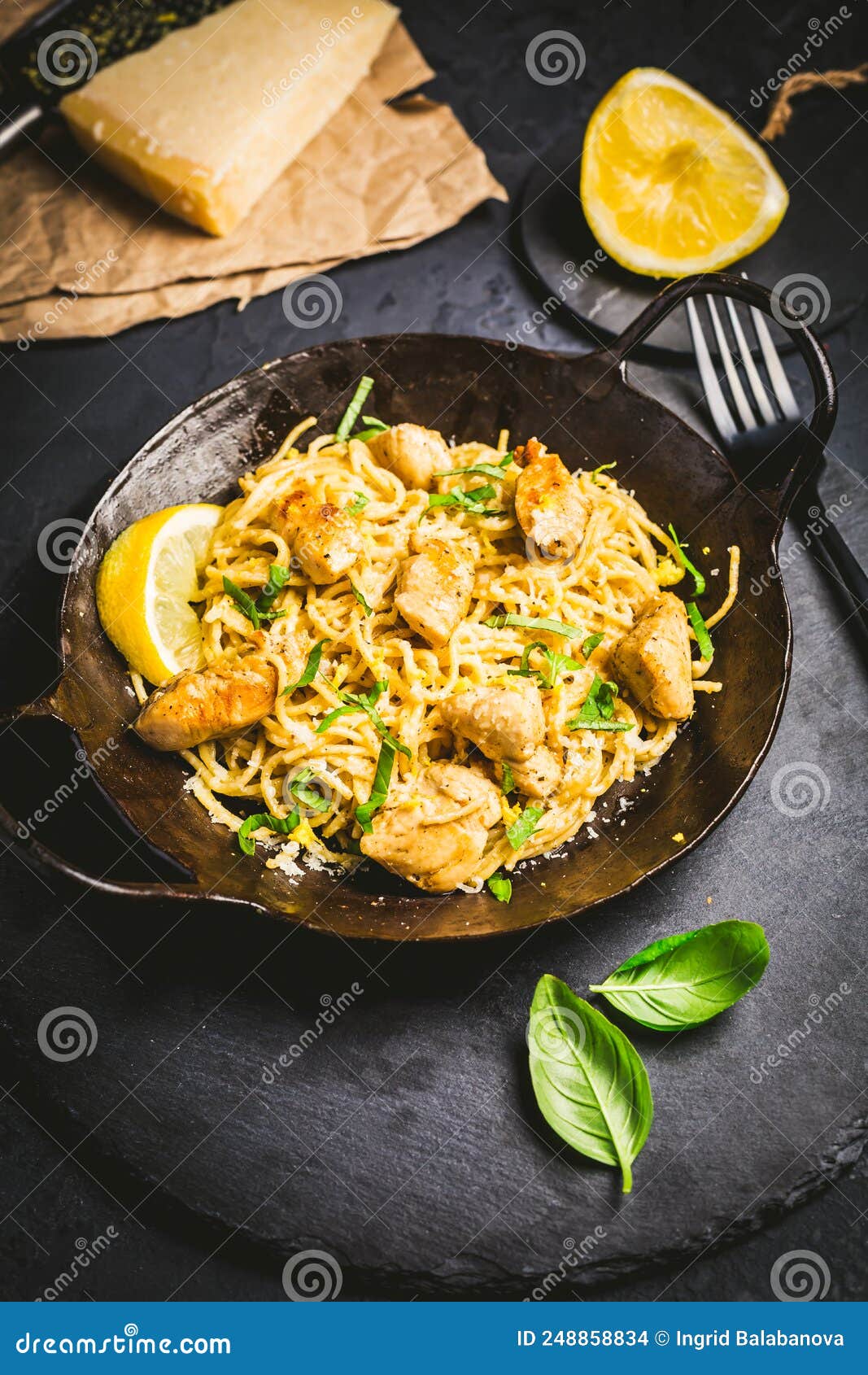 Lemon Chicken Pasta in Cast Iron Pan with Basil and Parmesan Stock Photo Image of garlic