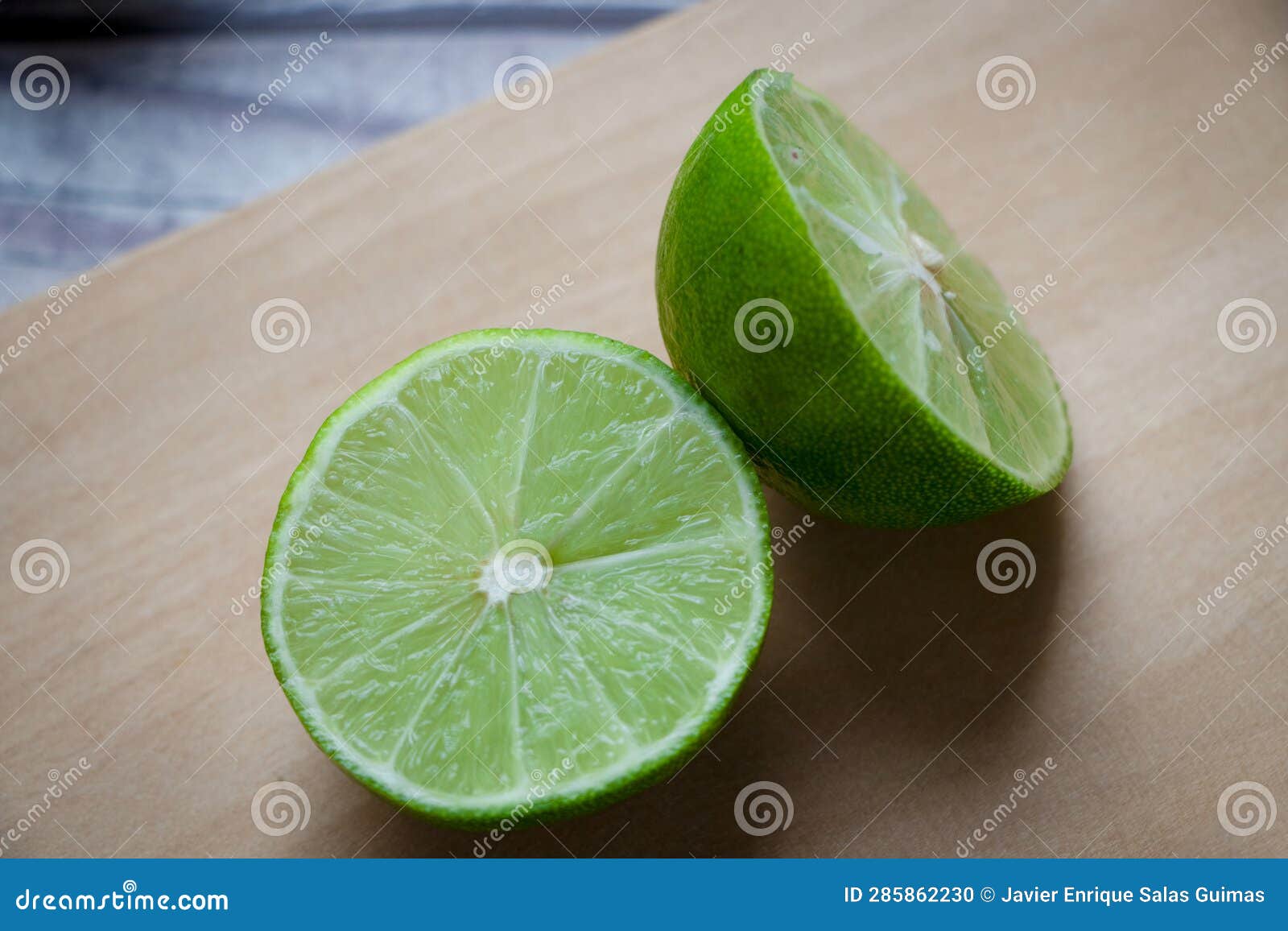 a lemon cut in half on a chopping board