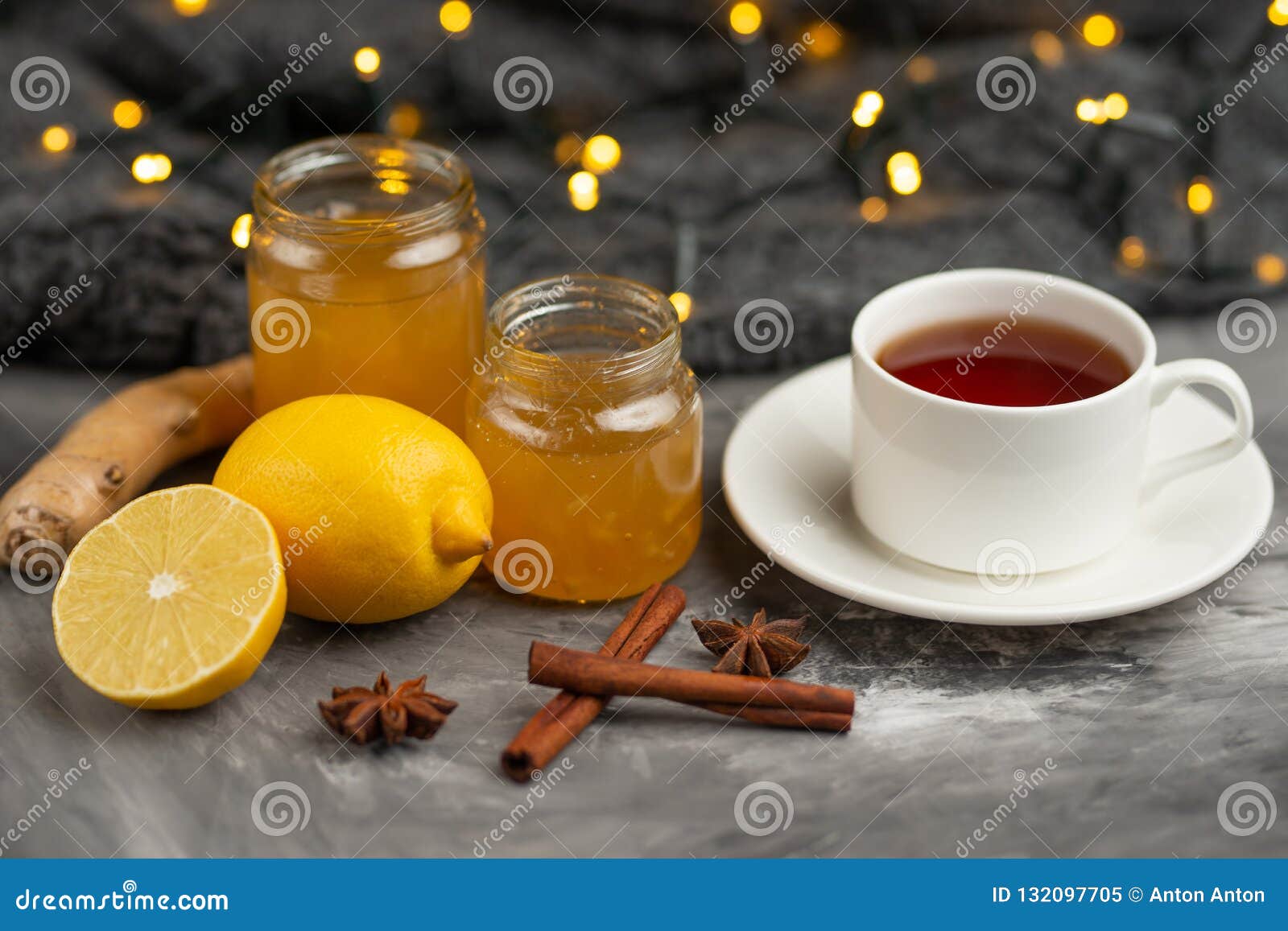 Lemon and Ginger Jam with Toast and Spices, with a Cup of Tea on a Dark