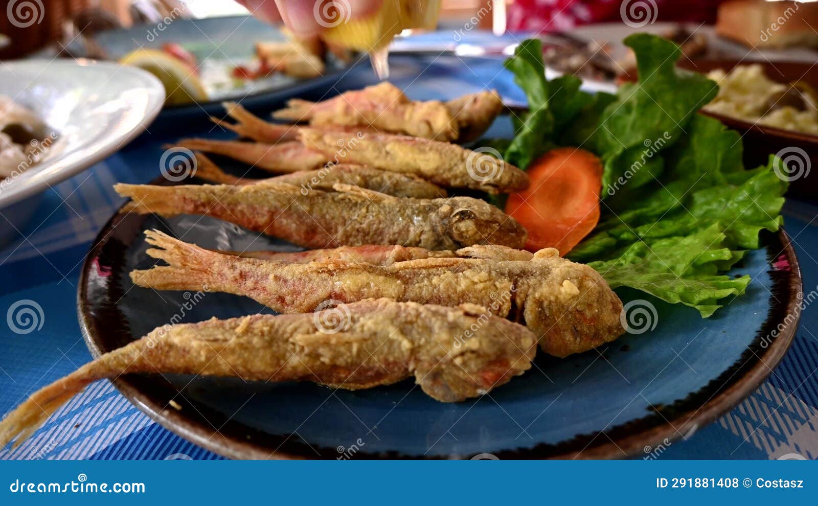 Lemon juice to fried fish stock footage. Video of time 291881408