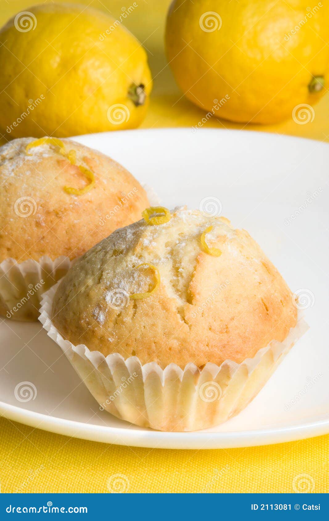 Lemon muffins on yellow