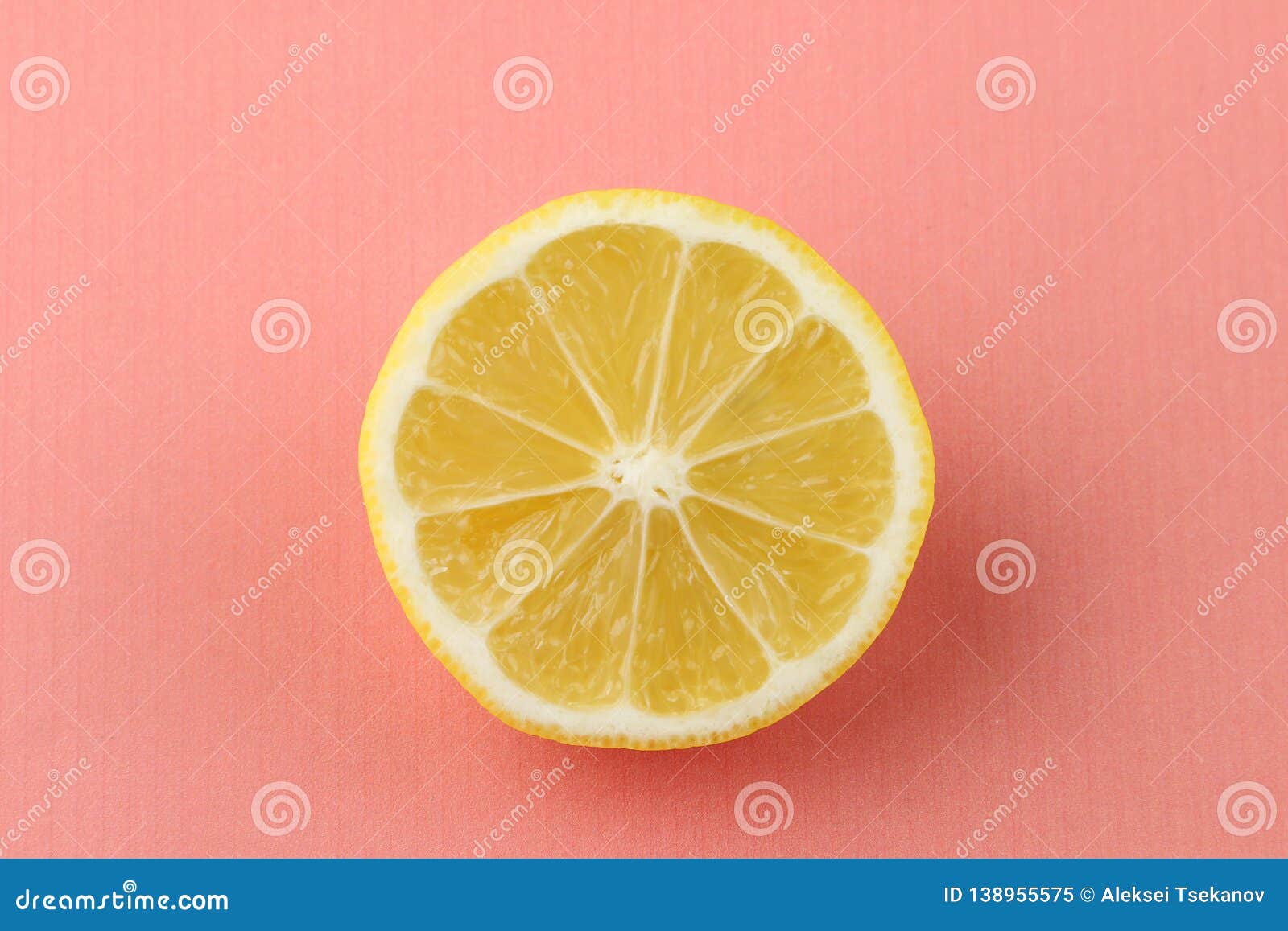 Lemon Slice on Coral Background Top View. Half Lemon Close Up Stock ...