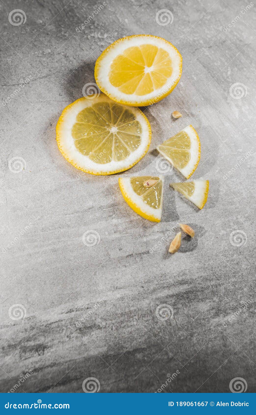 lemon slice on gray table. fresh citrous fruits piece,  with copyspace