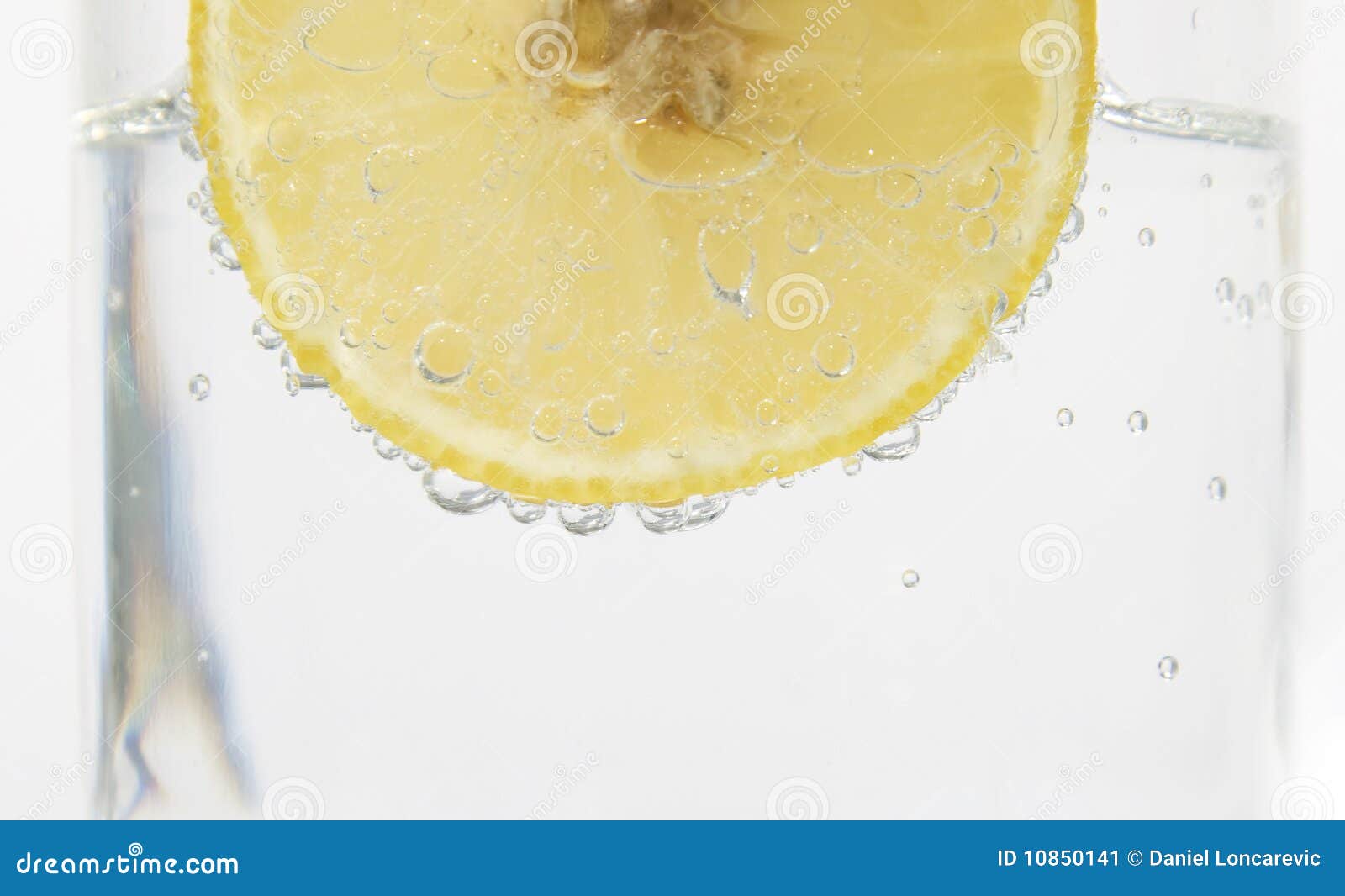 Lemon in sparkling water stock image. Image of sparkling 10850141