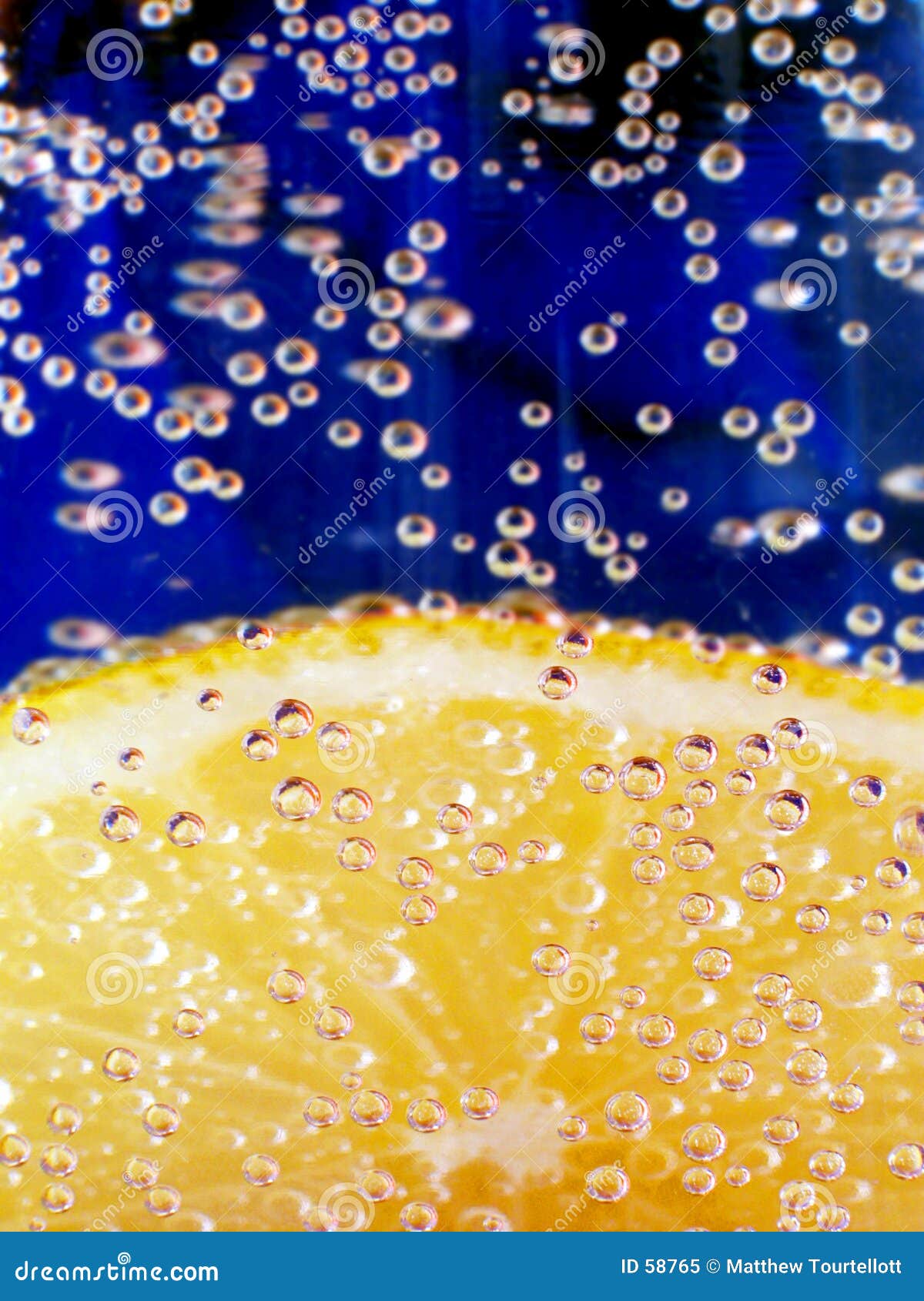 Lemon in Sparkling Water 2 stock image. Image of bubbles 58765