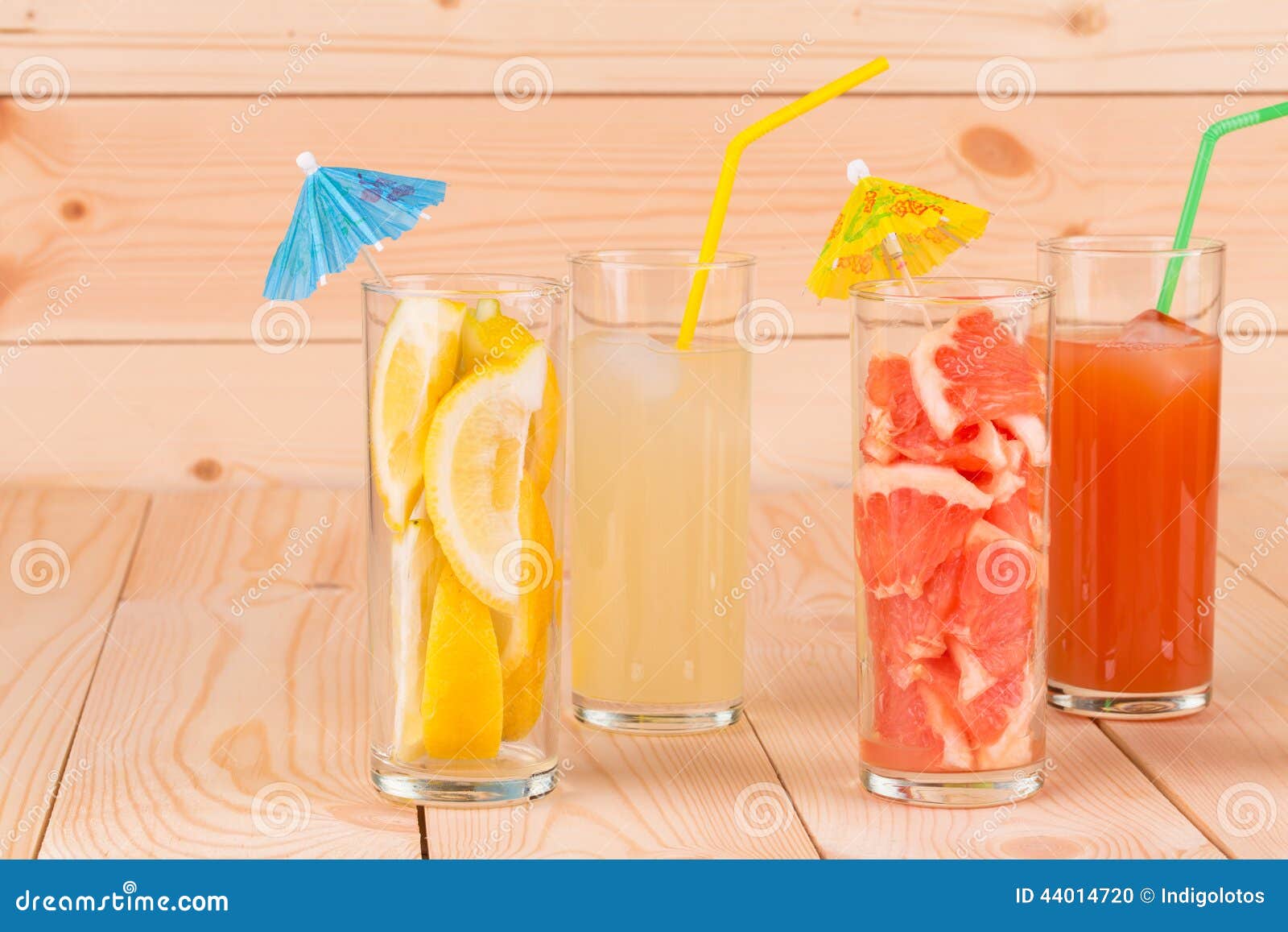 lemonade and grapefruit juice on table.