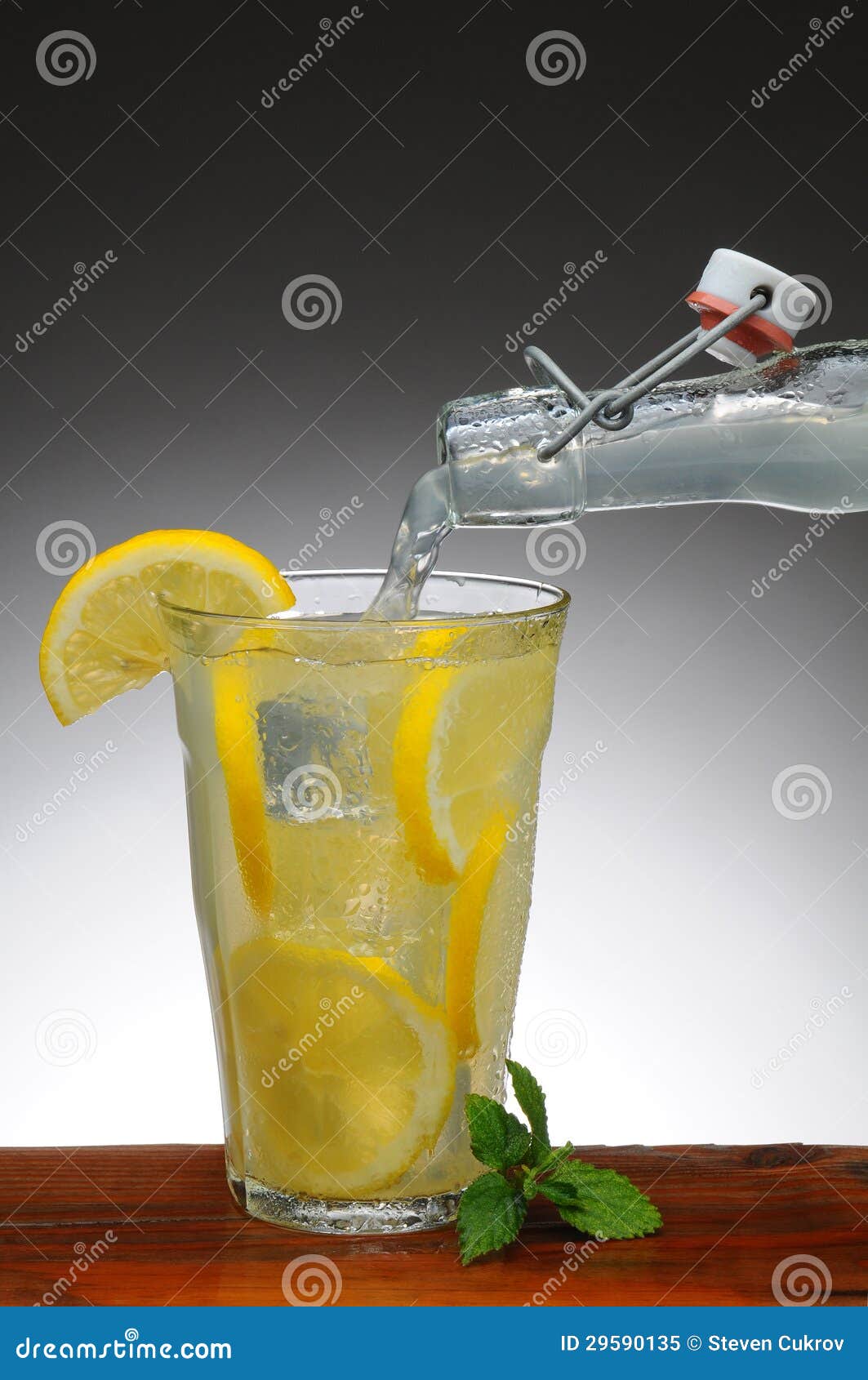 Lemonade Pouring from Bottle Stock Image Image of bottle, dark 29590135