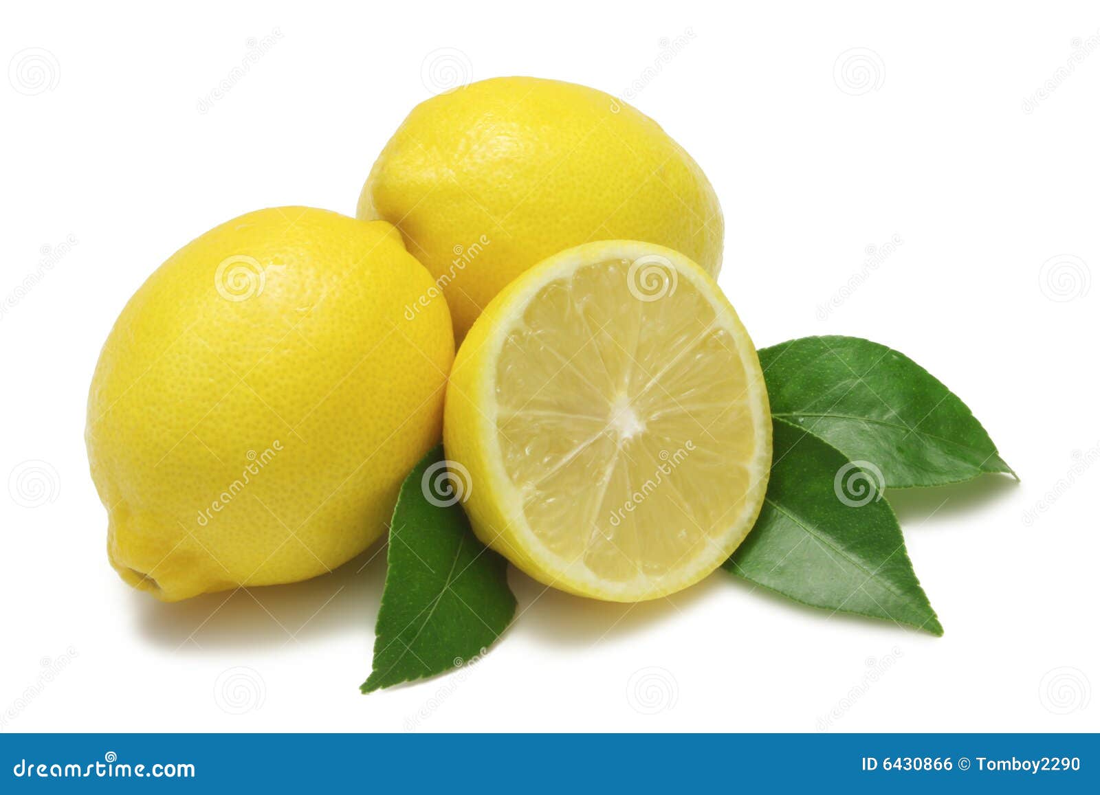 Two whole lemons, one half lemon, with leaves, isolated on white with clipping path