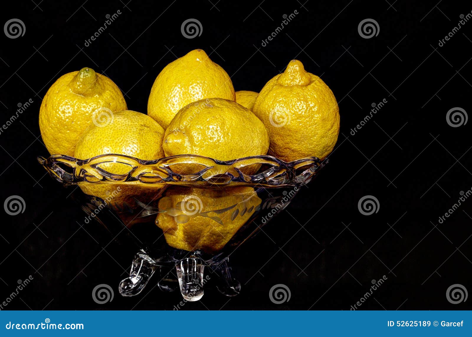Lemons on a glass bowl stock image. Image of texture 52625189