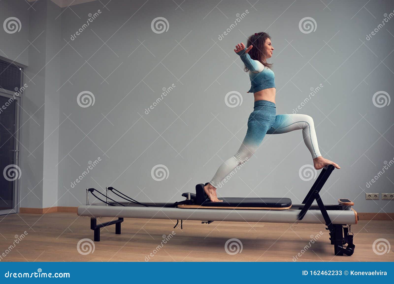 Leotard Workout Pilates Training. Athletic Pilates Reformer Exercises.  Pilates Machine Equipment. Young Asian Woman Stock Image - Image of  reformer, silhouette: 162462233