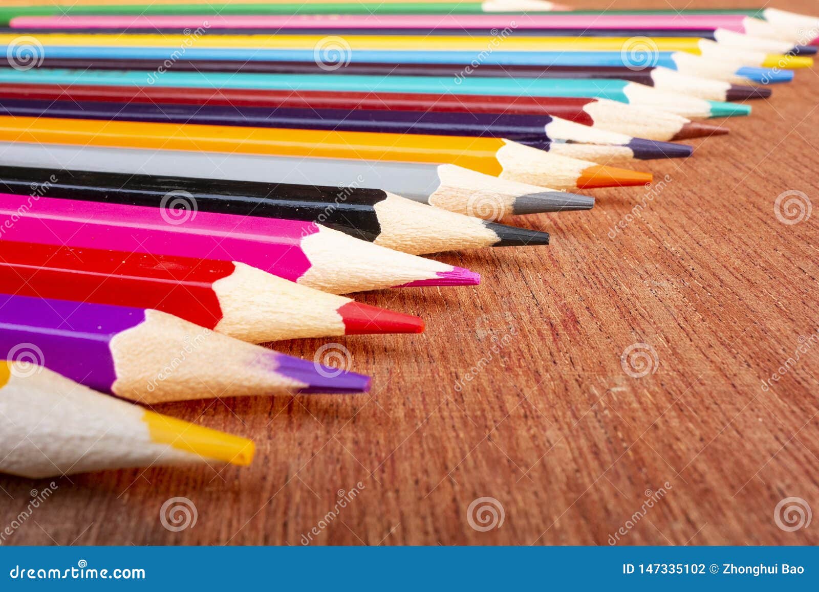 Coloured pencils arranged neatly on the desktop