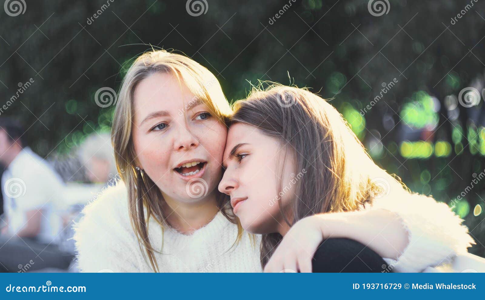 Two Young Lesbians Are Playing Music Guitar And Kalimba On The Sofa In The Living Room Stock 