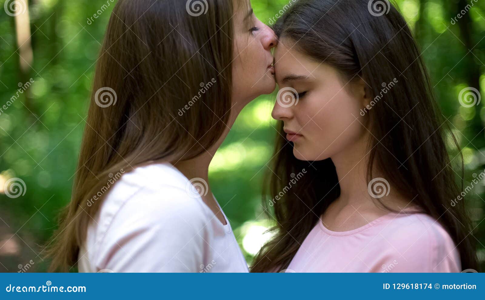 Lesbian Kissing Forehead of Her Loving Girlfriend, Gentle Attitude, First Love Stock Photo picture photo