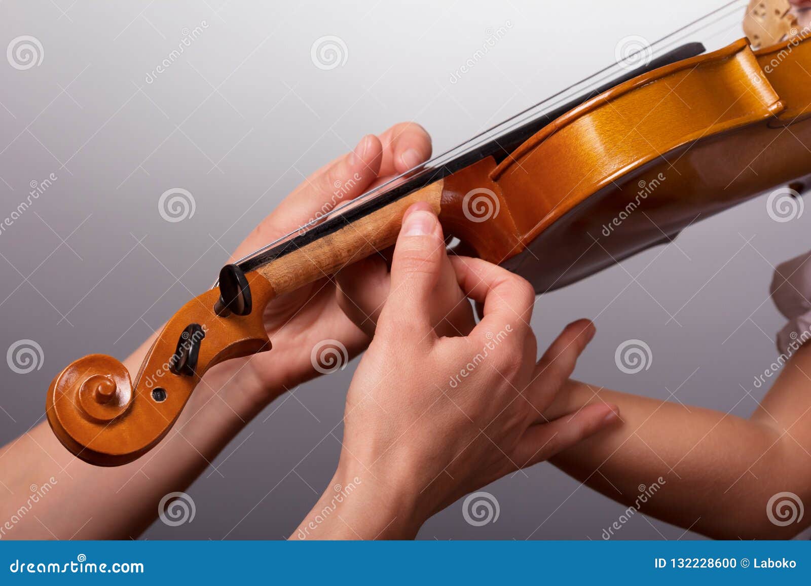 The Lesson of Playing the Violin. Teacher Helps To Hold the Violin