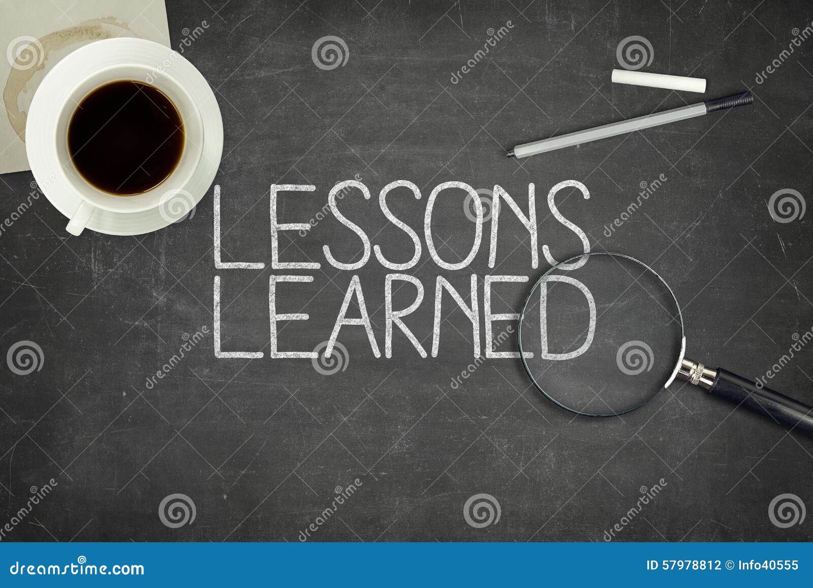lessons learned concept on black blackboard