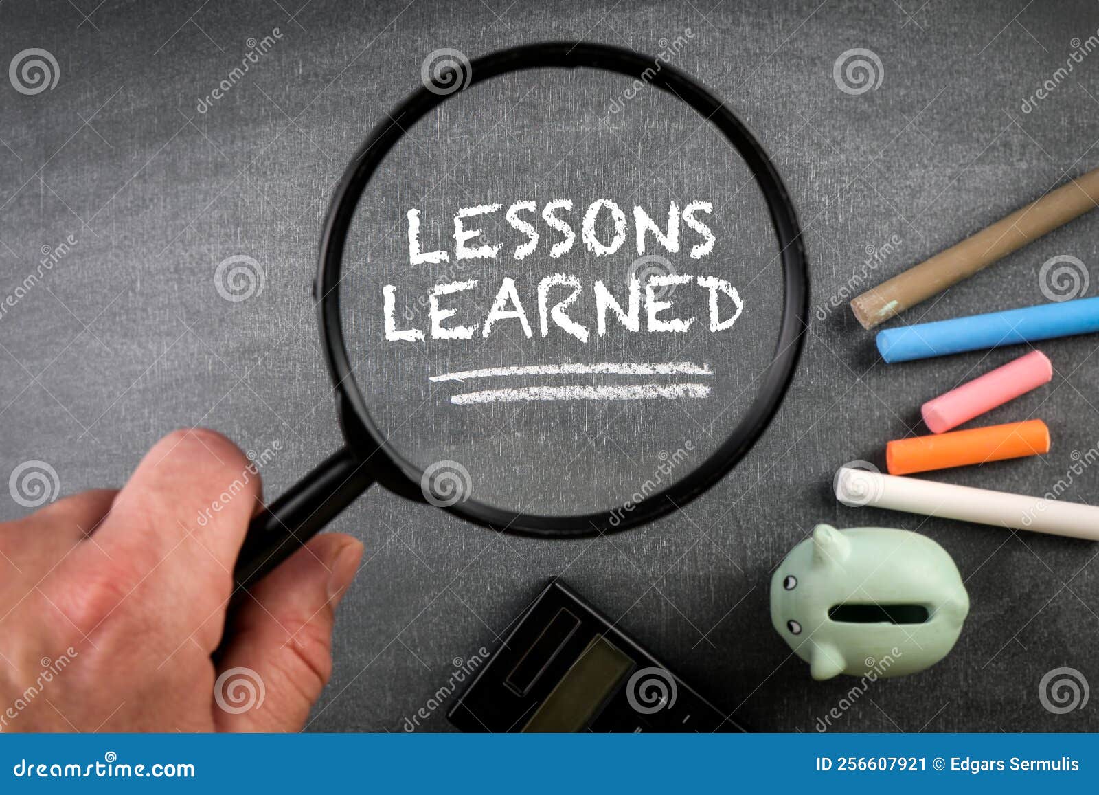 Lessons Learned, Education Concept. Chalk Board and Magnifying Glass