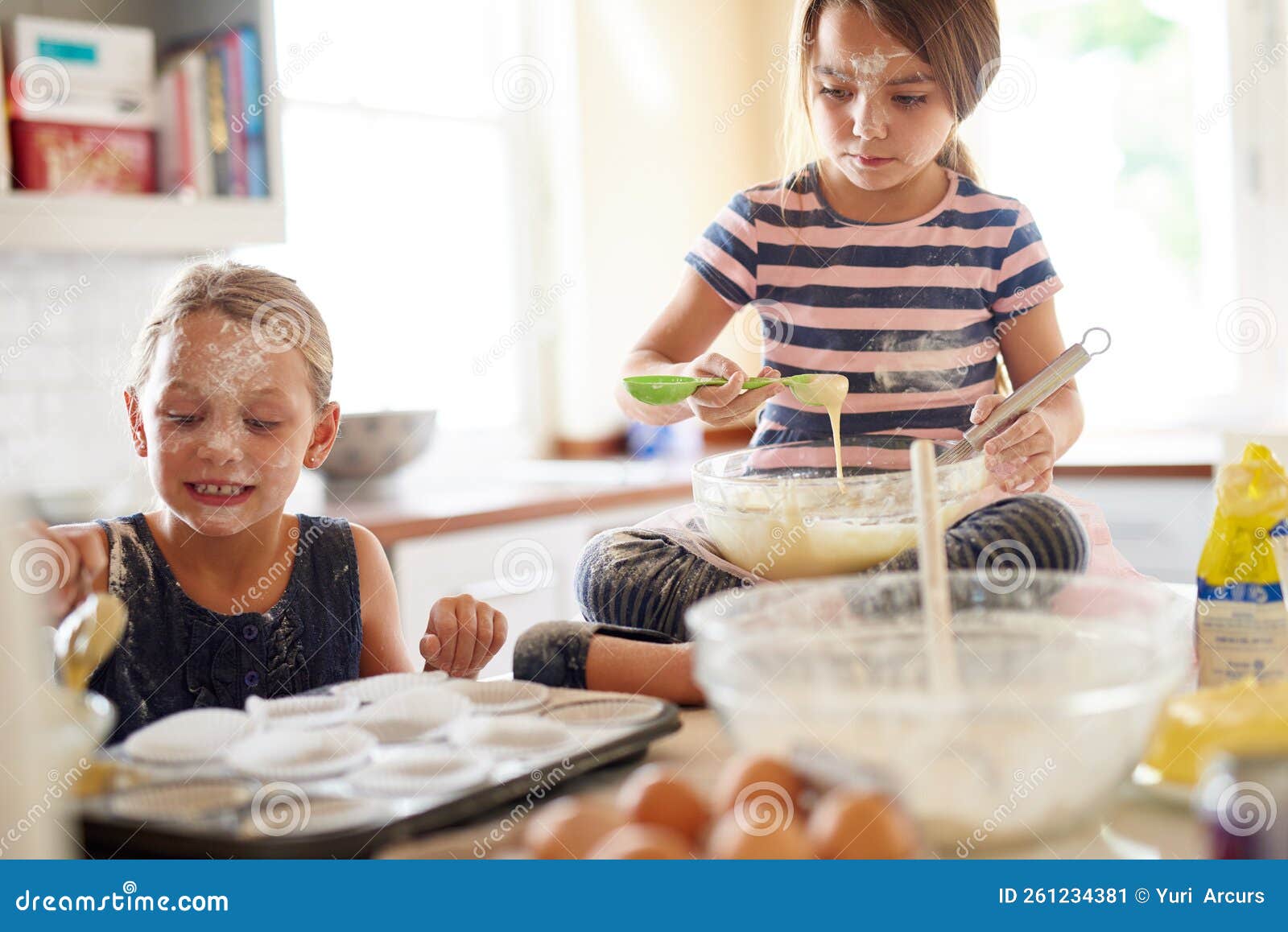 Lets Get Baking. Two Little Girls Baking in the Kitchen. Stock Image