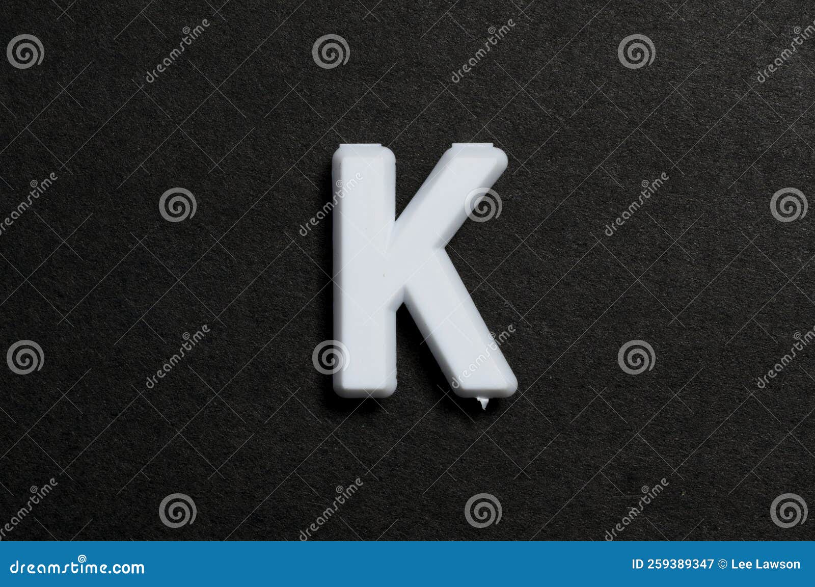 Pegboard Letter K on a Black Background Stock Image Image of