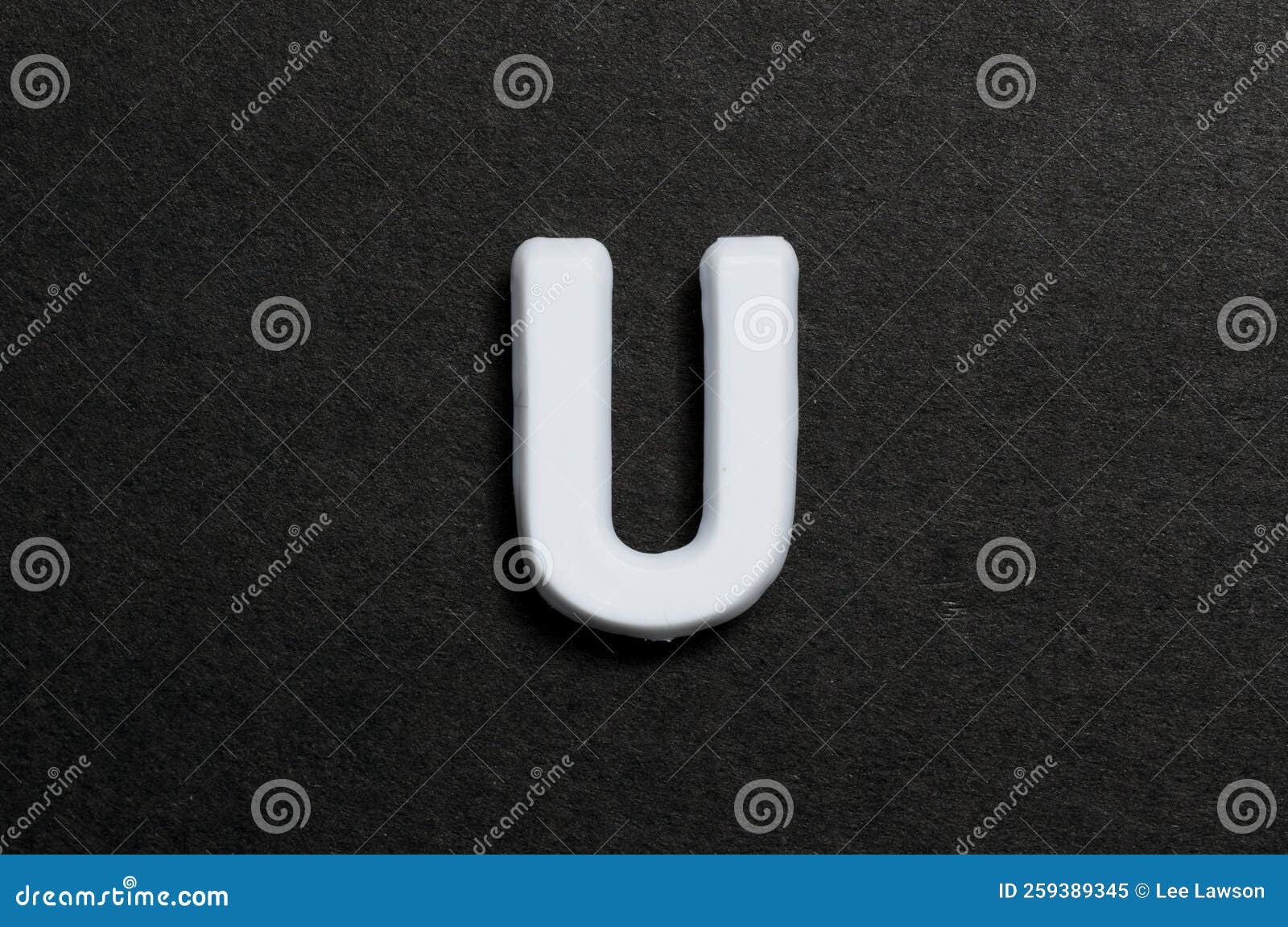 Pegboard Letter U on a Black Background Stock Image Image of closeup