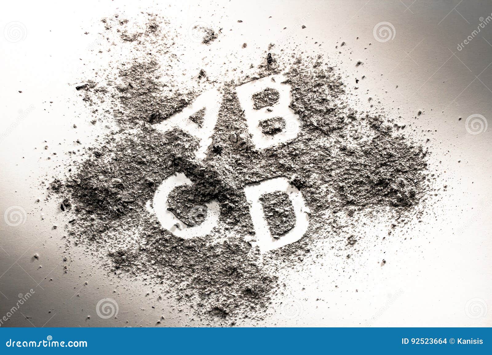 letters a, b, c, and d written in grey ash, sand, filth or dust