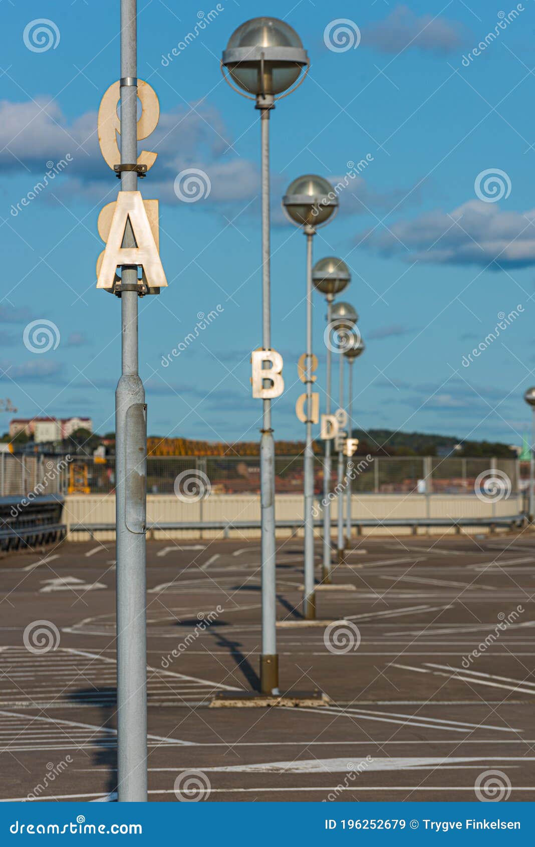 Letters on Poles Marking Rows at a Parking Lot Stock Image Image of line, floor 196252679