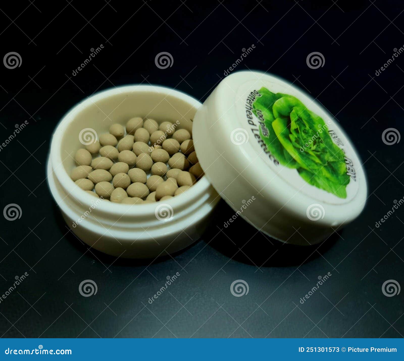 Lettuce Butterhead Pelleted Seed in Packed in Plastic Jar Stock Image