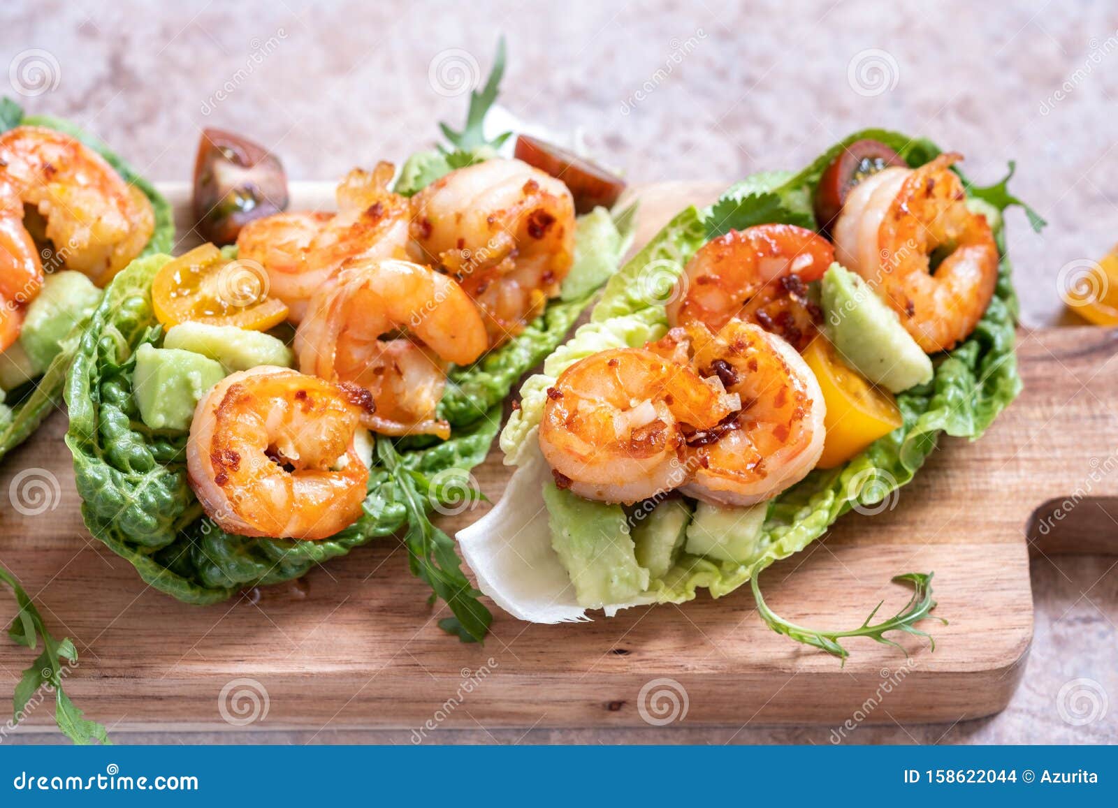 Lettuce Wrapped Shrimp Tacos with Fresh Tomato and Avocado Stock Photo