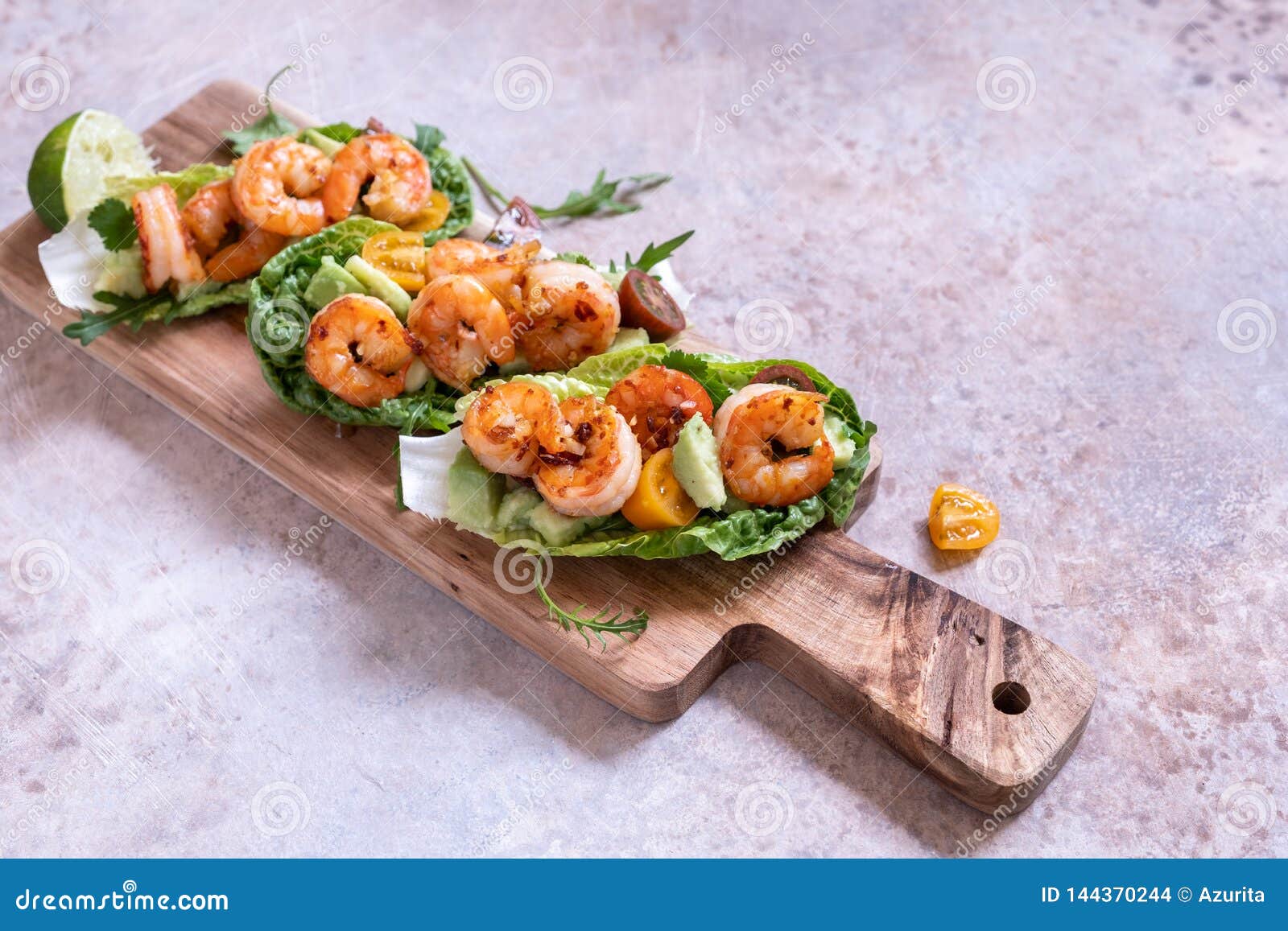 Lettuce Wrapped Shrimp Tacos with Fresh Tomato and Avocado Stock Photo