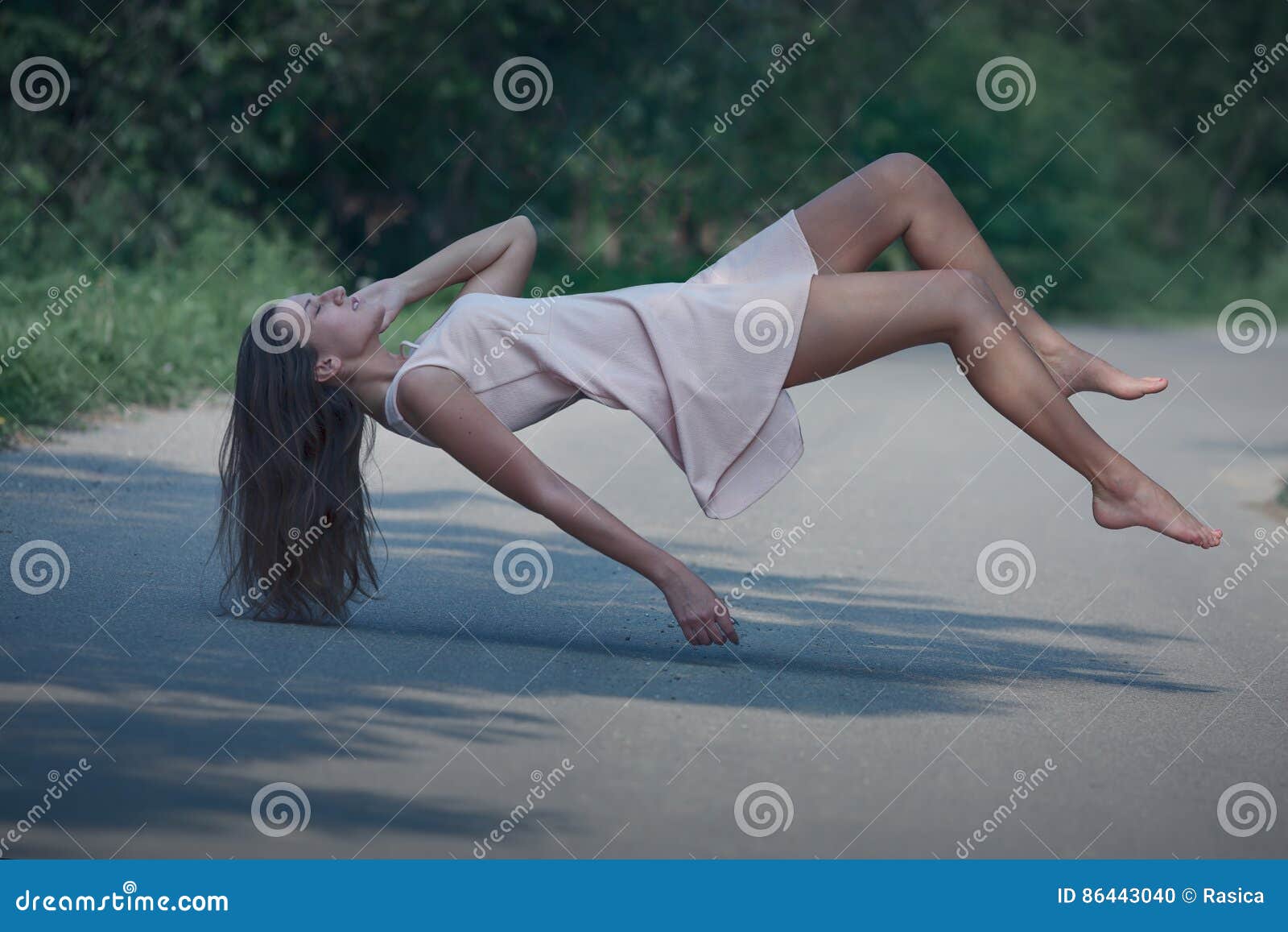 levitation portrait of young woman on the road