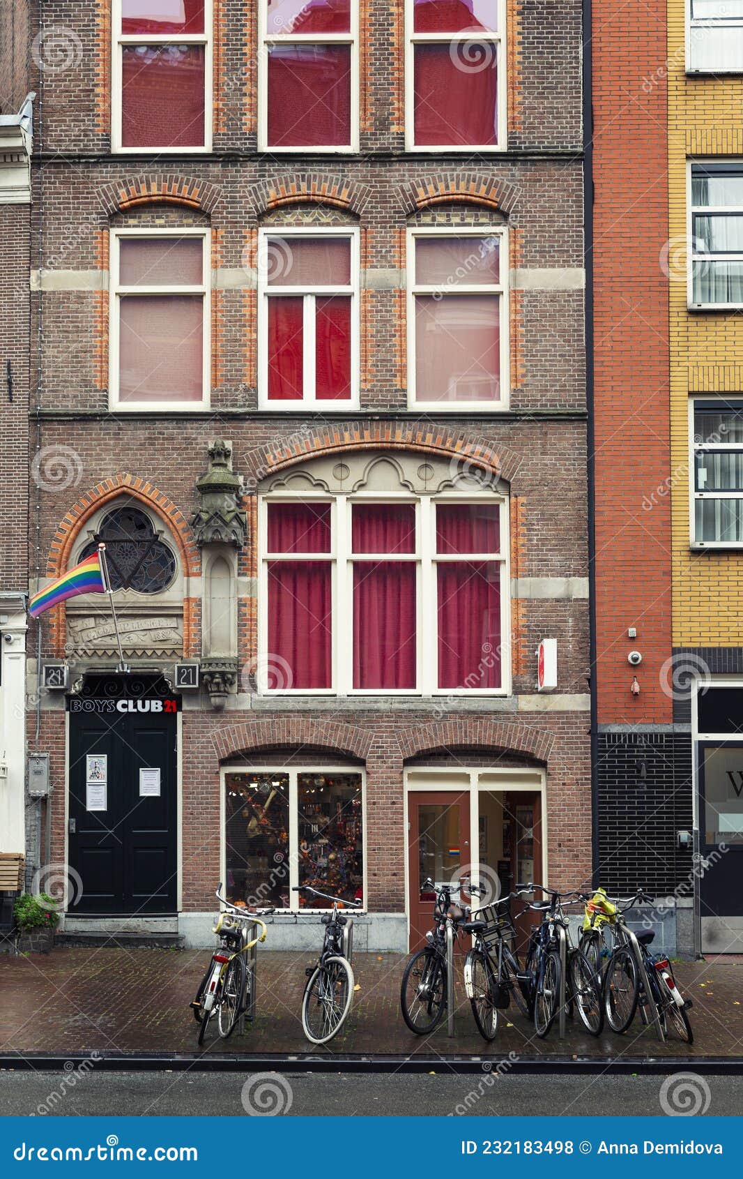 Lgbt Community Gay Club with Rainbow Flag on the Facade of a Brick