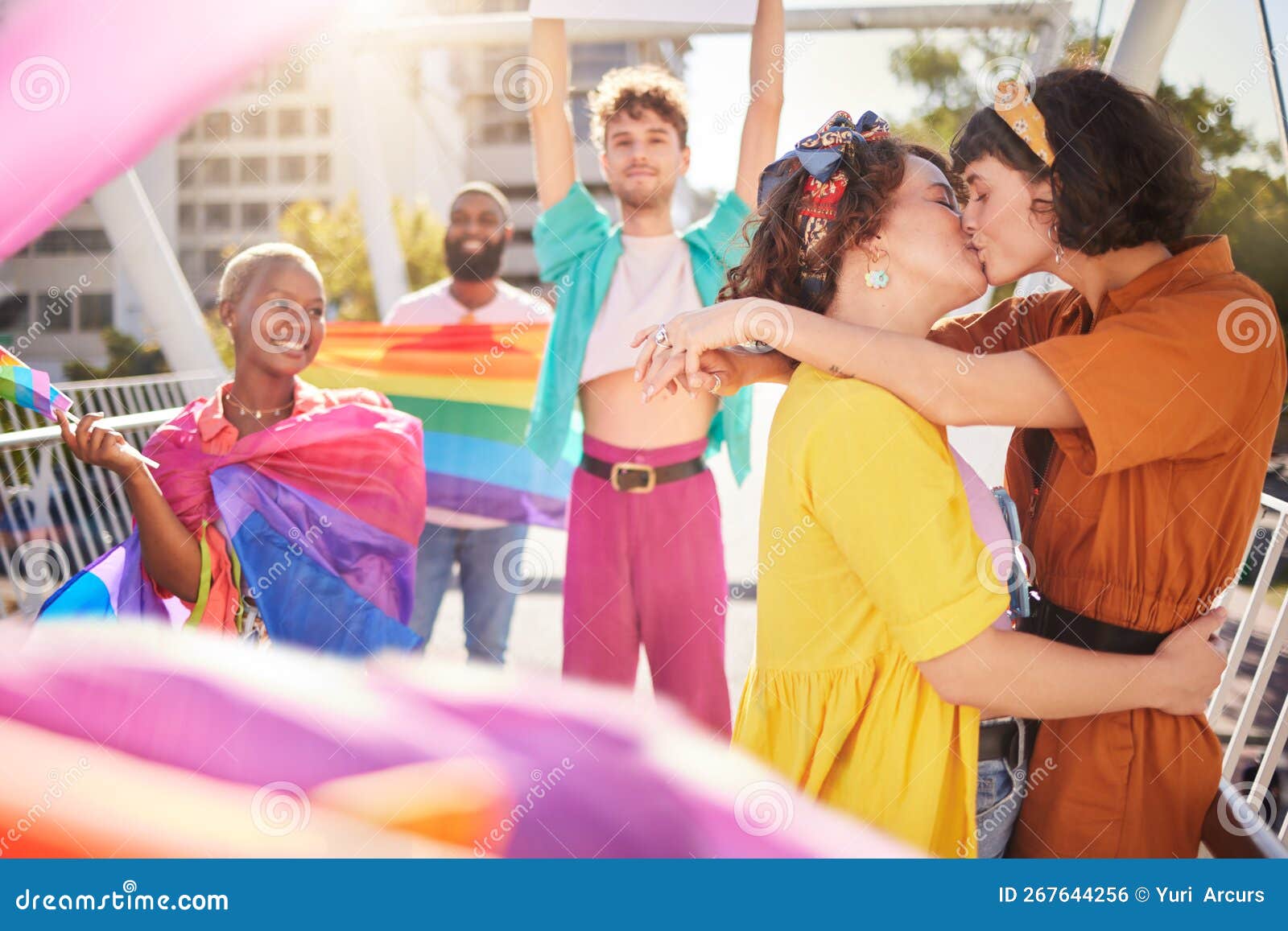 Lgbt Kiss And Couple Of Friends In City With Rainbow Flag For Support Celebration And