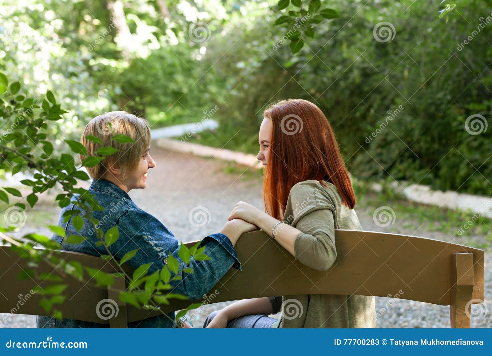 LGBT Women. Young Lesbian Couple Walking in the Park Together. Delicate Relationship picture