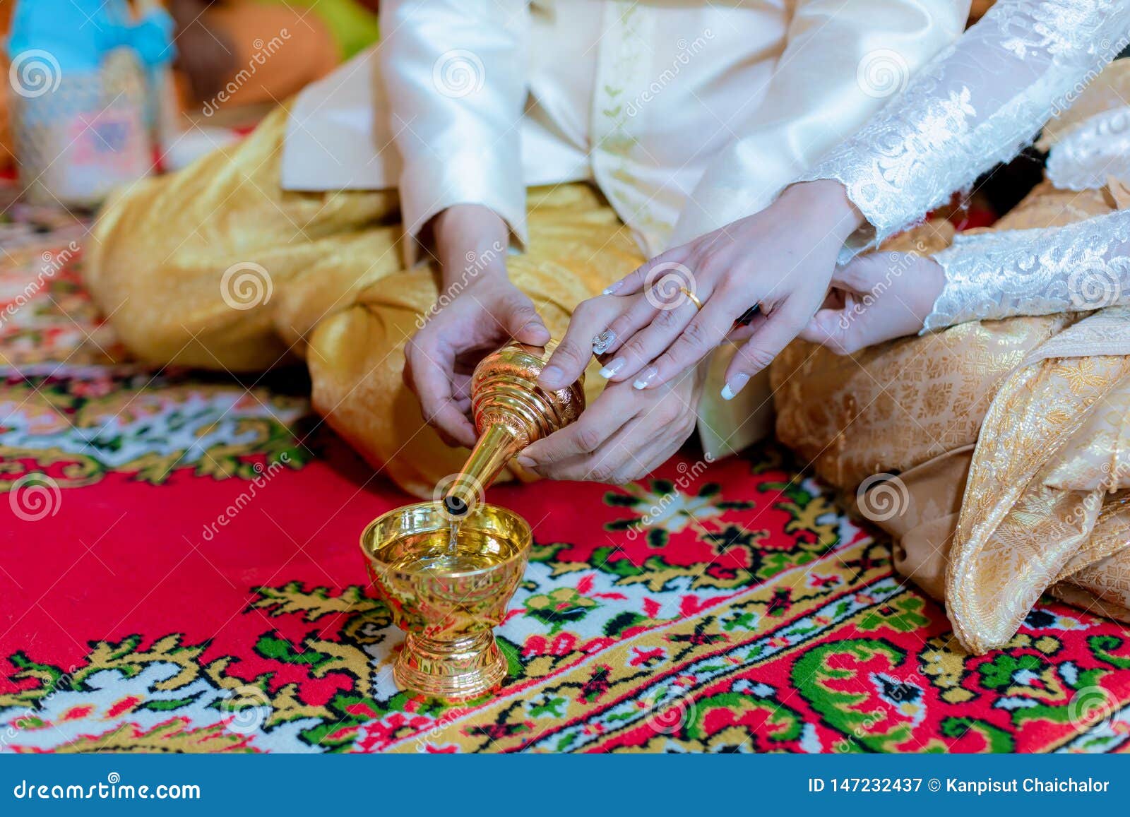 libation, thai engagement, pour water in thai wedding, pouring water in thai wedding.