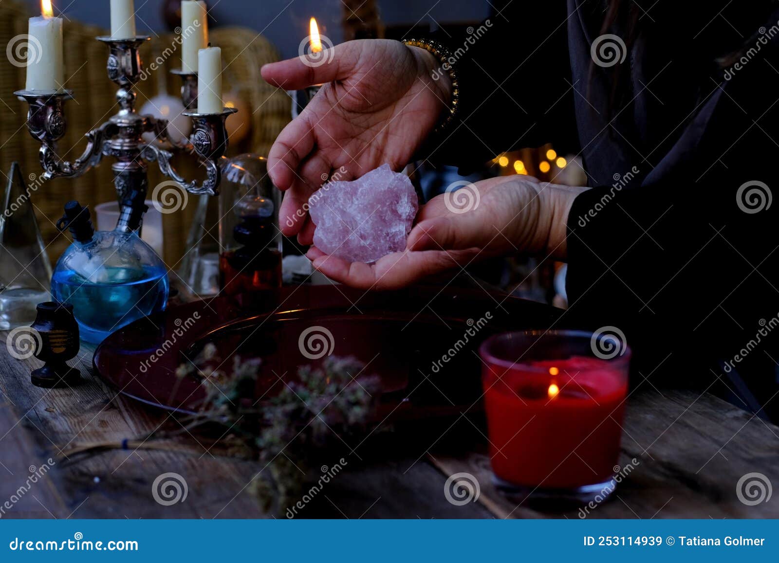 librate with pendulum, healing or oracle foretelling, magic session, female fortuneteller or esoteric oracle performs spell,