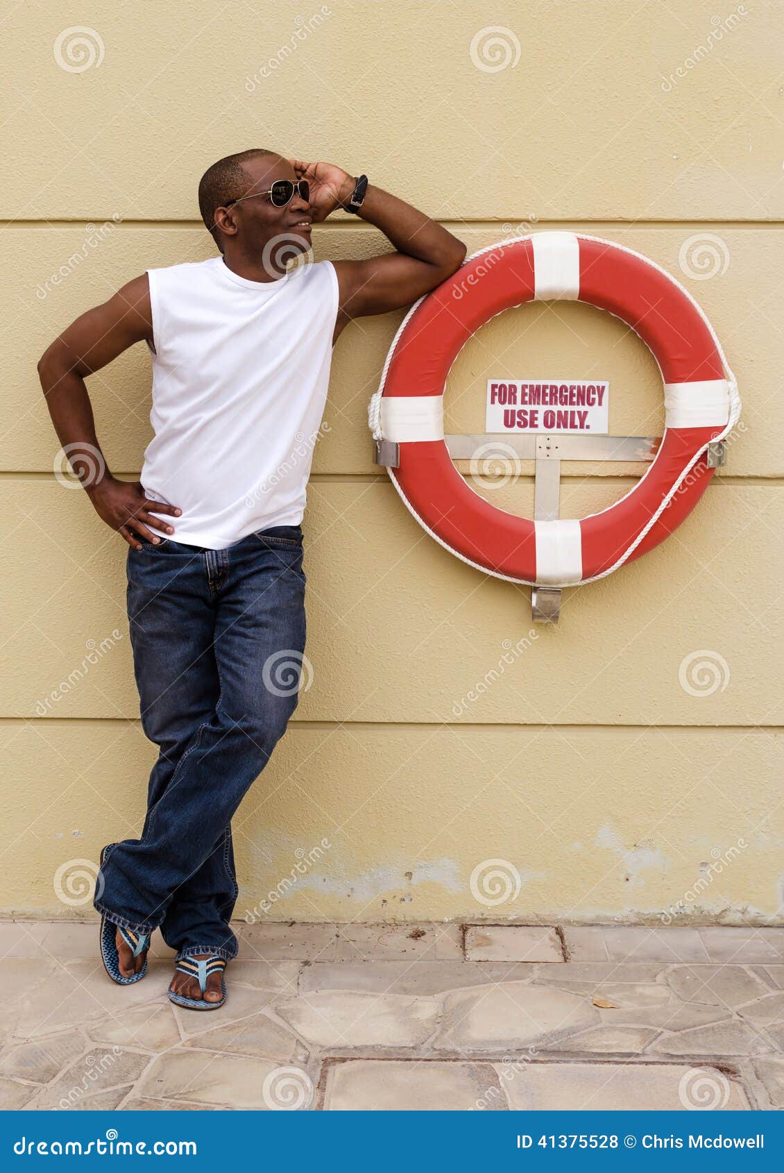 A Black Male Poses Next To Life Ring Stock Photo - Image of emergency ...