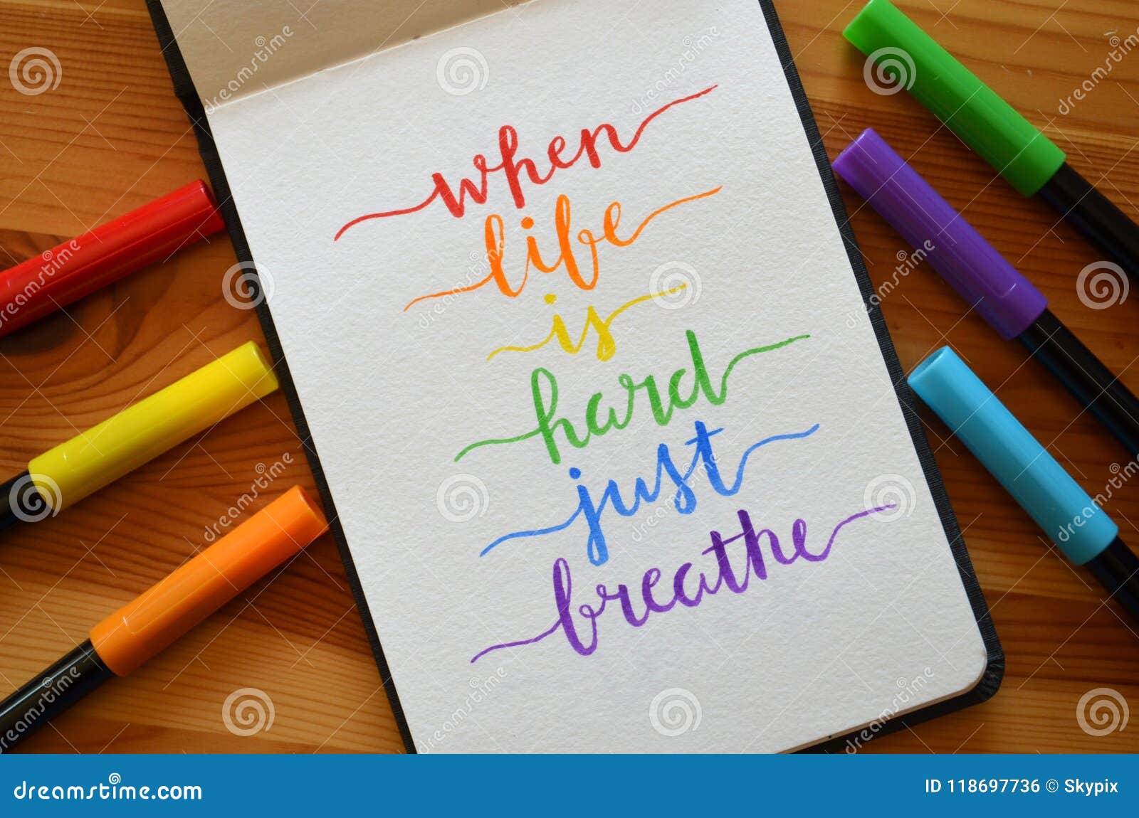 when life is hard just breathe hand-lettered in notebook