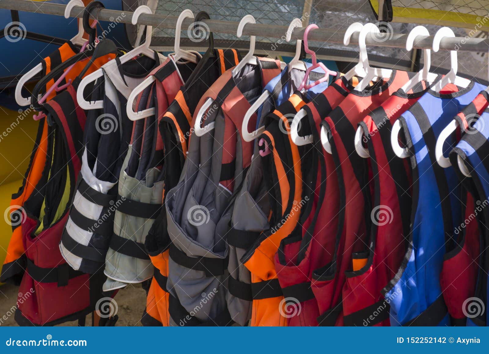 Life Jackets on Hanger Closeup. Colorful Life Vests Stock Photo - Image ...