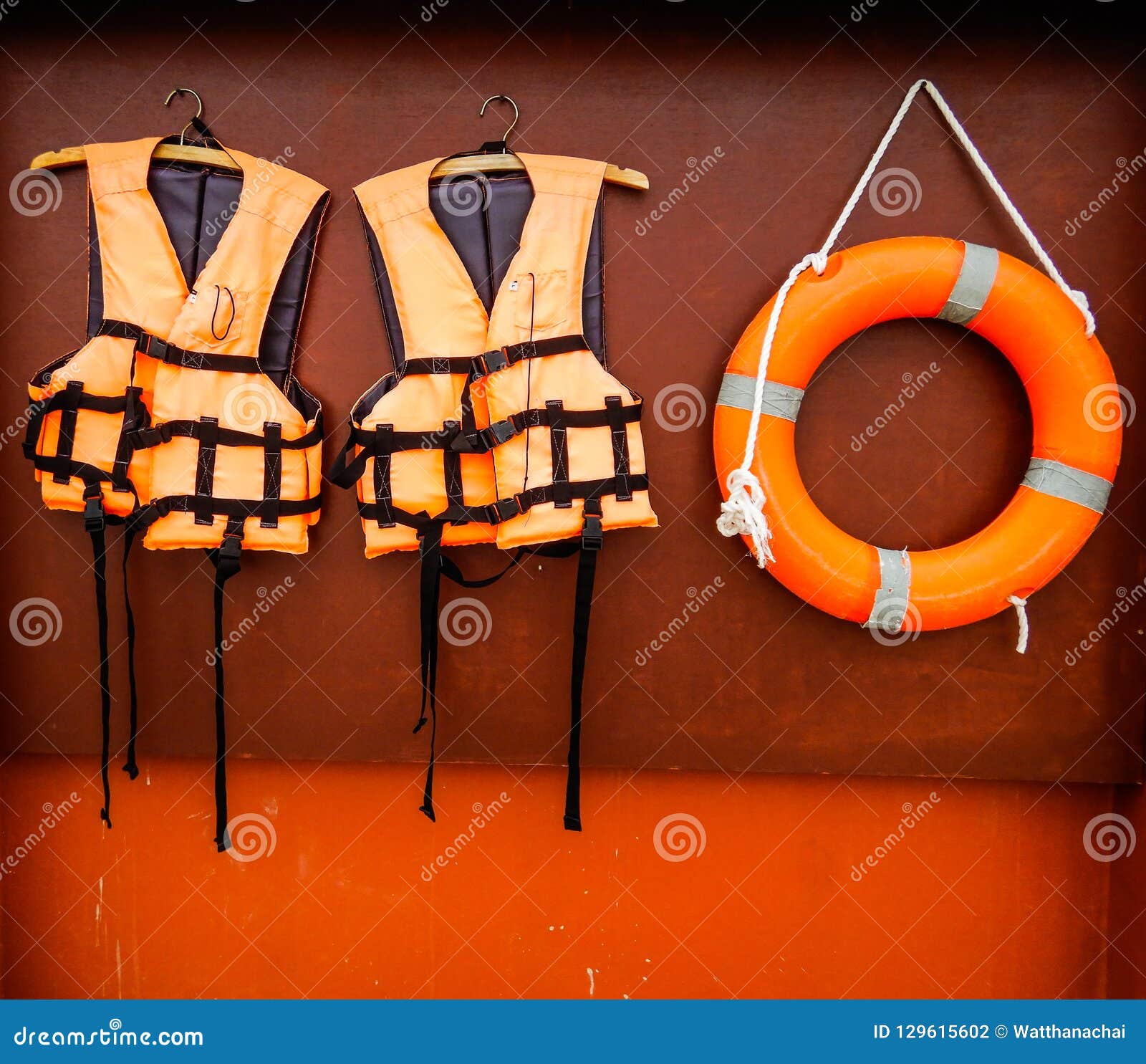 Life Jackets and Life Ring Hanging on the Wall. Stock Photo Image of