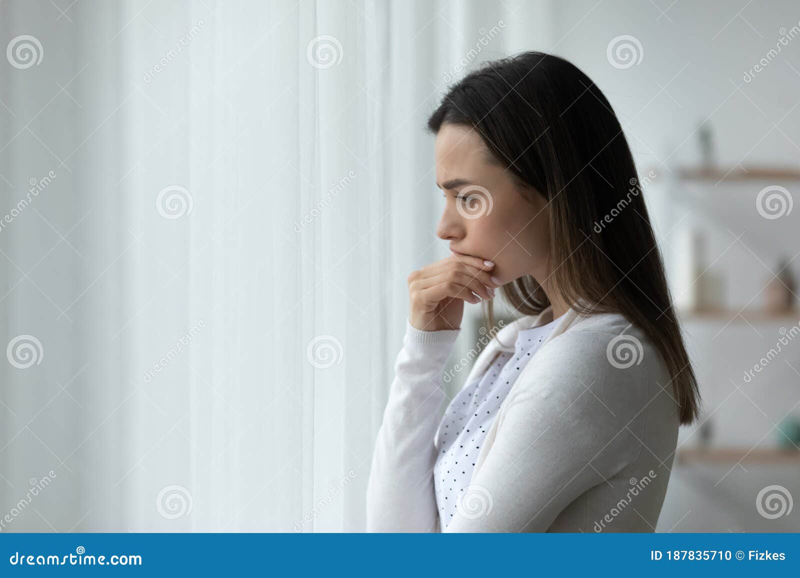 pensive sad woman standing thinking over problems search solution